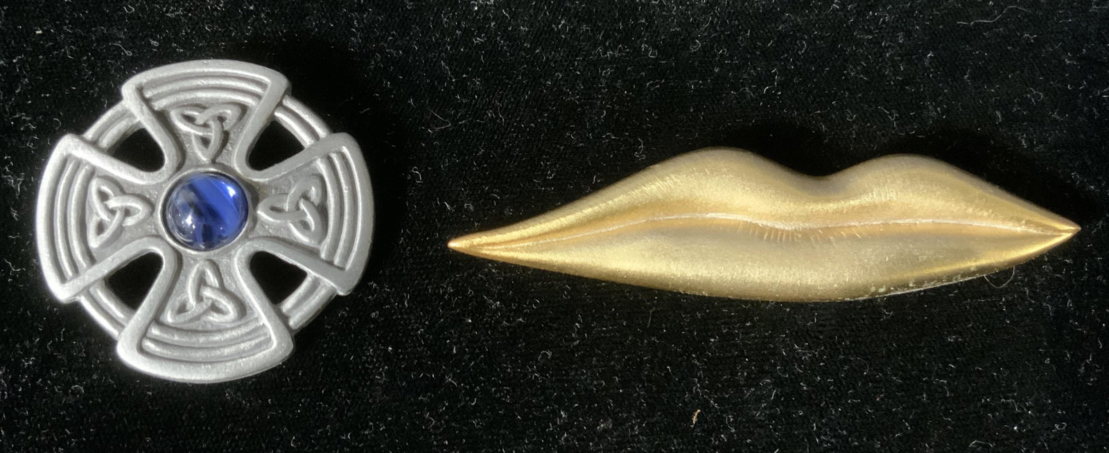 Lot 2 Man Ray & Celtic Inspired Pins: Lot 2 Man Ray & Celtic Inspired Pins, triangular inscription to reverse of Man Ray pin, measures 3 3/8 x 7/8 inches, inscription to reverse of circular pin reads ‘DMH’, measures 1 3/4 inches in di