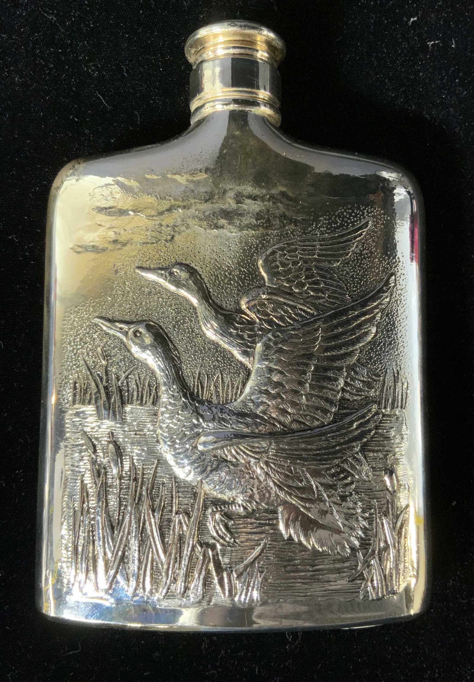 Vintage GODINGER Silver Plated Repoussé Flask: Vintage GODINGER Silver Plated Repoussé Flask, inscriptions read ‘Exclusively made for GODINGER Silver 1985 Tarnish Resistant Japan’, measures 6 x 4 inches, surface wear to piece, Vintage, GODING