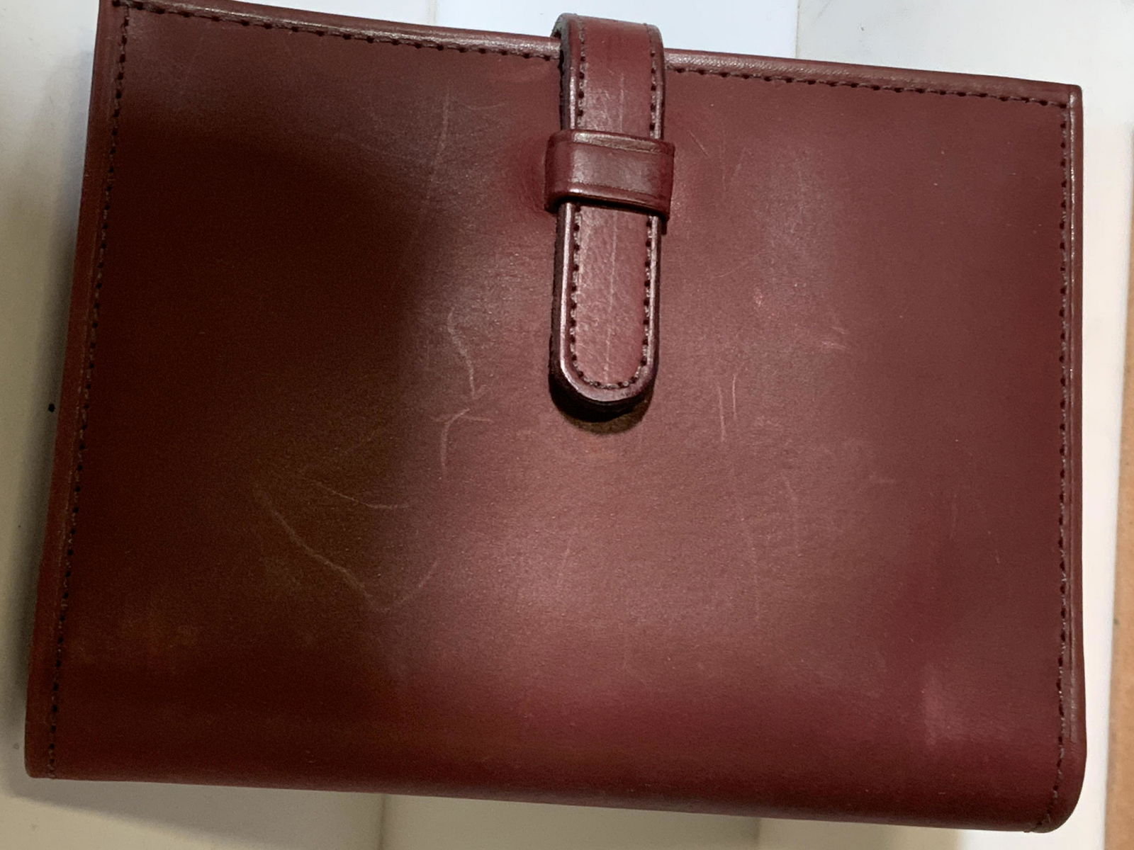 COACH Burgandy Leather Ladies Wallet: Vintage Pre owned wallet comes in box labeled Coach. Billfold section, coin section with snap, slips for 4 credit cards. 4.75 in. x 3.75 in. x .75 in. , 7.5 in. Long when opened. Very light leather ma