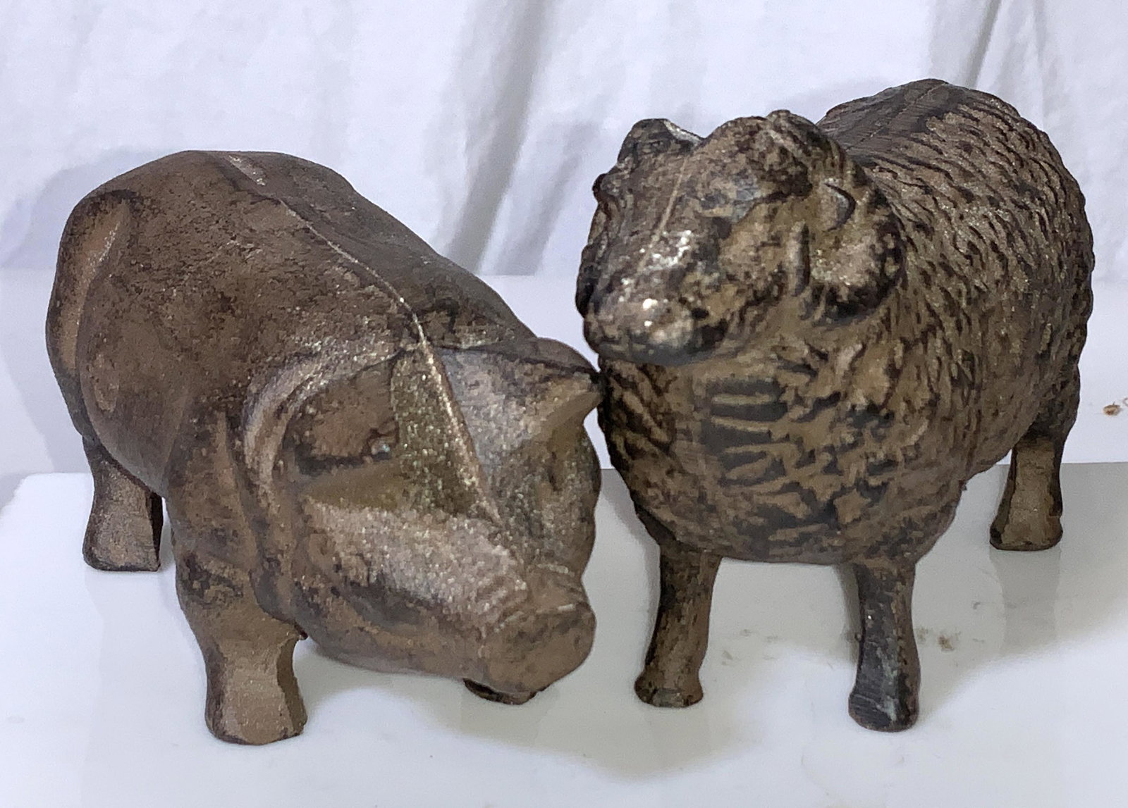 Cast Iron Pig and Ram Figurals: Farm and Ranch Animals Figurals brushed with a brown patina. Cast iron. Pig 6 in long, sheep ram 5.5 in long, 3 in. Ht. Ranch decor, Country home decor and accessories, Farm animal paperweights, Farm 