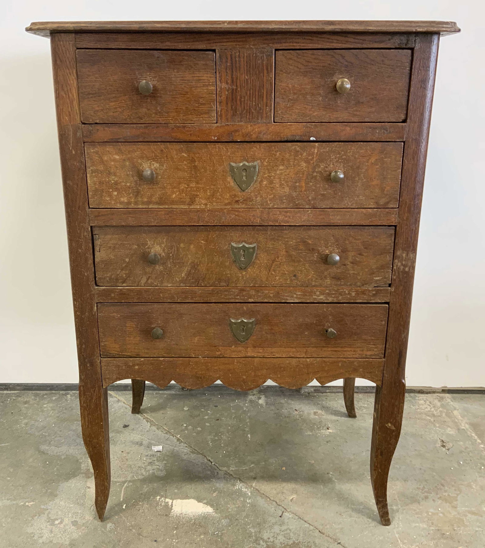 Antique Wooden Nightstand: Wooden nightstand, appears to be antique. Brass hardware present on each drawer, key absent. Measures approx 28 inches H, 20 inches W, 13 inches deep. Wear is consistent with age and use, bottom drawe