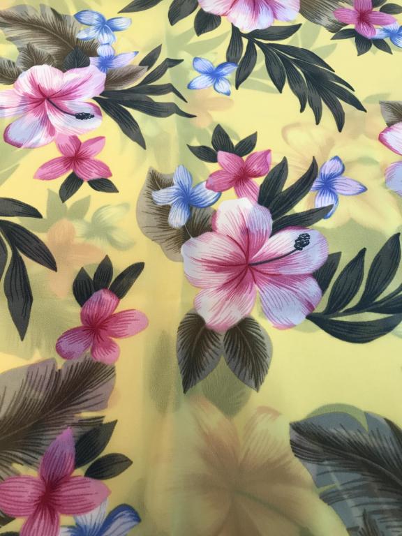 Tropical Flower Shawl, Wrap SESSA: Base yellow With pink and blue tropical flowers. Label reads 100% polyester, one size, made in Mexico with USA FABRICS. Approx 24.5 x 55.5 in. No fabric issues noted. Shawl, Scarf, Wrap, Beach Sarong,