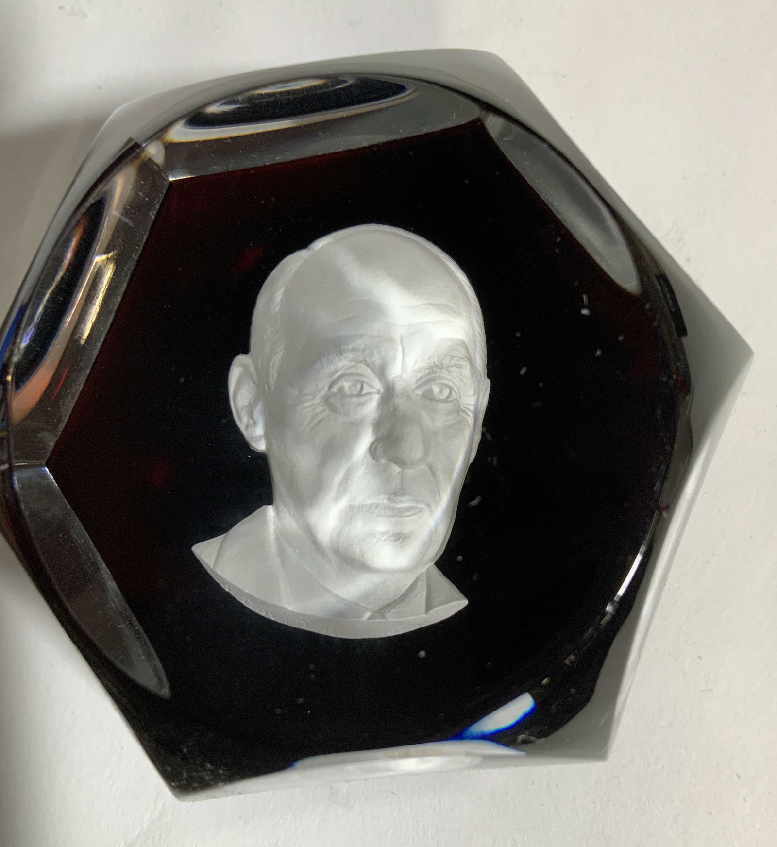 BACCARAT 3D Cameo Paperweight , A David Paris: Crystal Sulphide 3D Medallion Cameo of A. David PARIS encased in a faceted dome shape with burgundy color. FRENCH BACCARAT crystal, stamped with Baccarat symbol and marked 1968. 1 1/2 inches by 2 inch