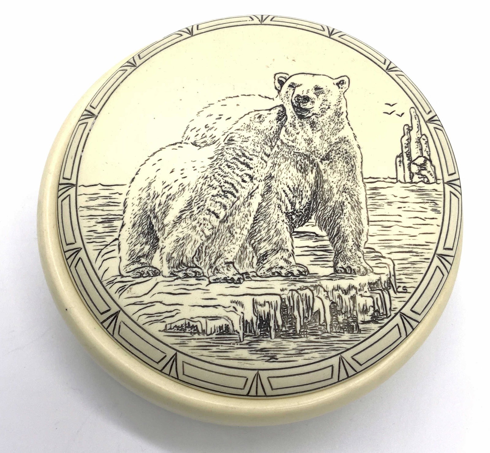 Canadian Composite Polar Bear Motif Trinket Box: A lidded composite trinket box accented with a etched polar bear motif across the lid. The design on the lid features a polar bear and ether cub standing atop a piece of ice at sea. Etched pattern alo
