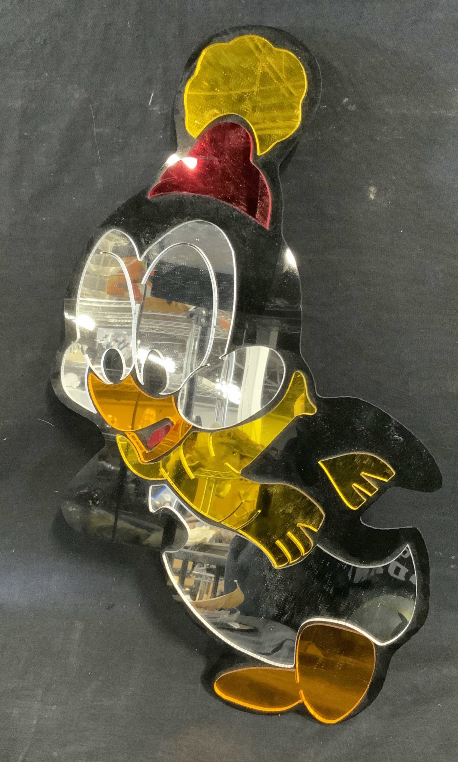 Mirrored Chilly Willy Wall Ornament: Mirrored chilly Willy wall ornament, label to reverse reads ‘Chilly Willy 1954, 1982 Walter Lantz Licensee Creative Accessories LTD Bellmore N.Y. 11710’, subject a cartoon penguin figure in scarf 