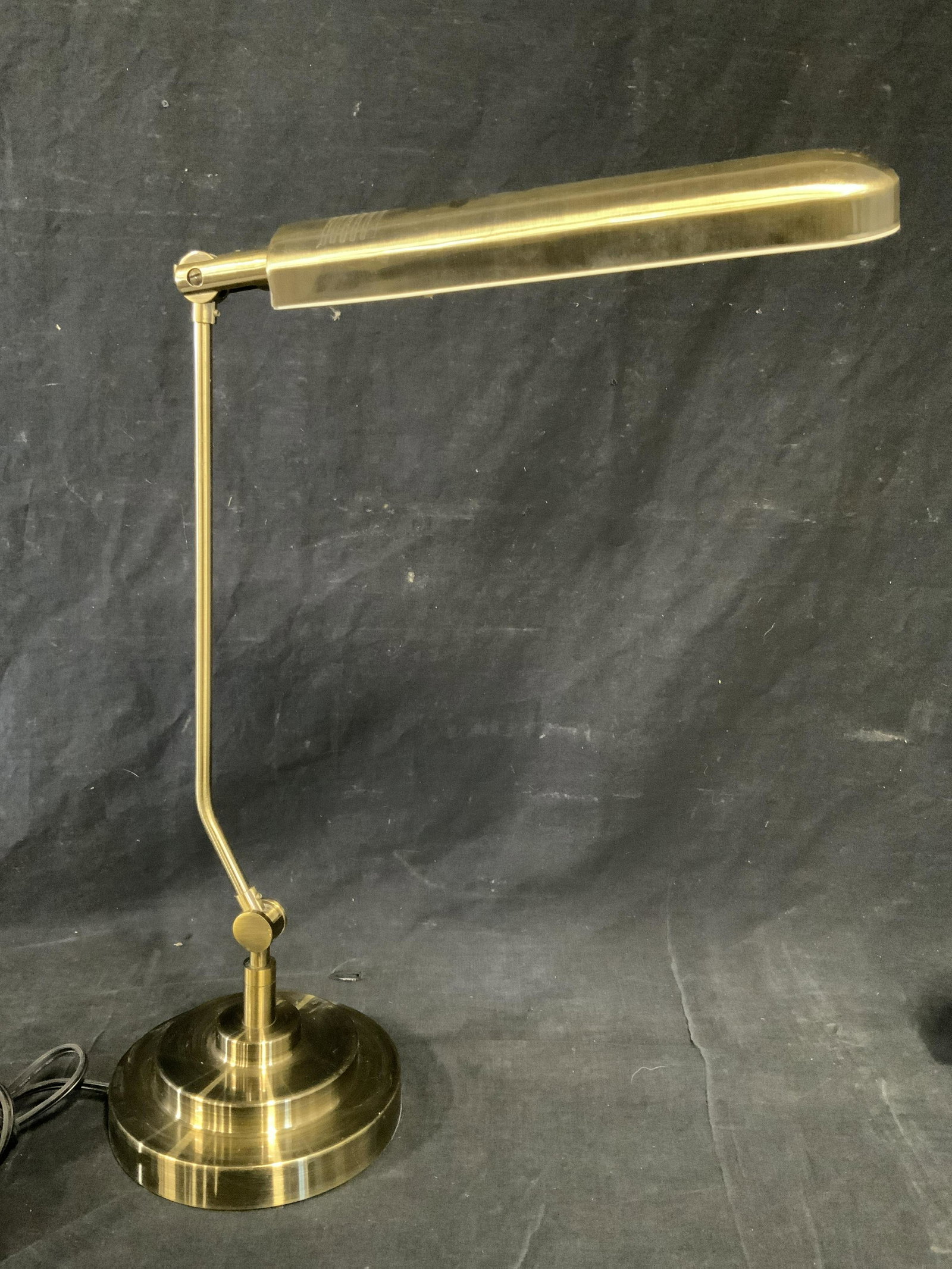 Modern Minimalist Table Lamp: Modern Minimalist table lamp, switch to cable of lamp, lamp has single bar light facet with adjustable arm, lamp measures approximately 20 inches tall with a base diameter of 7.5 inches, not tested fo