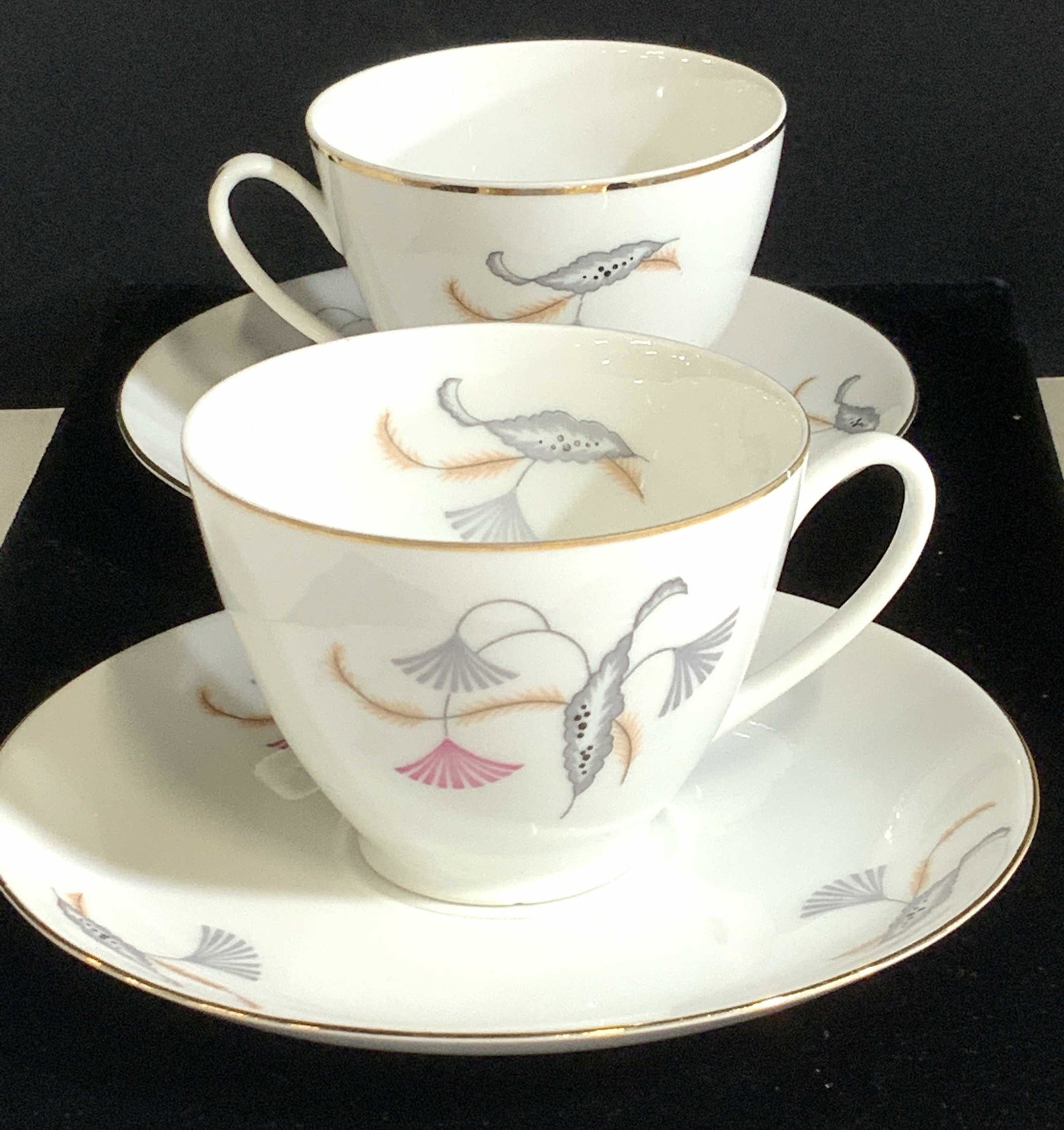 Partial Set Fine Bone China, Czechoslovakia, 23: White bone Chine, fine porcelain partial set of 9 soup bowls 7.75 in. & 7 tea cups with 7 saucers. Hand painted delicately with Asian Fan in grey and pink. Gilt lined, HALLMARKED FINE BOHEMIAN CHINA M