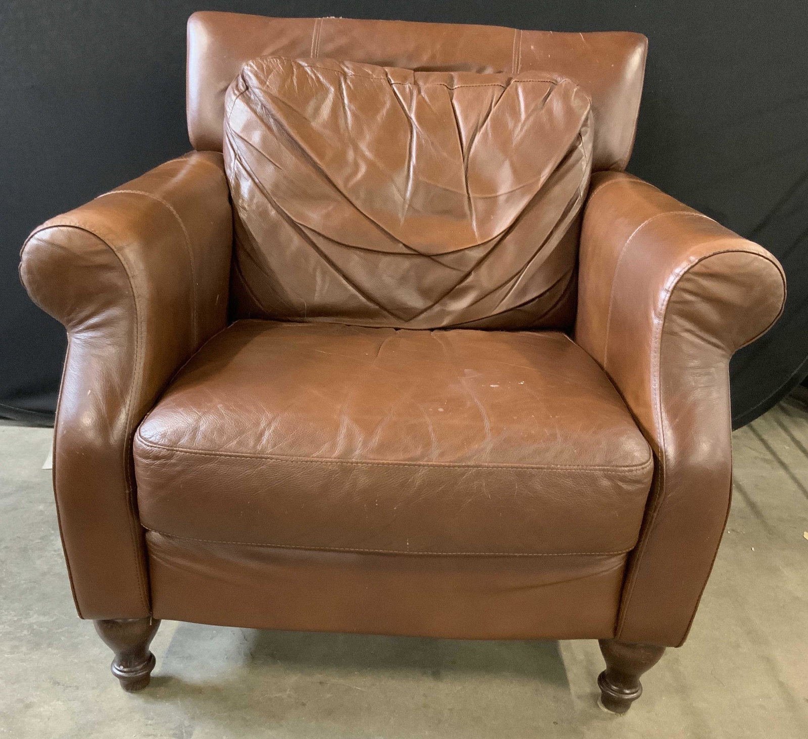 DIVANI CHATEAU D AX Leather Armchair: Underside of chair has tag which reads DIVANI CHATEAU D AX. Armchair is brown toned appears to be upholstered with genuine leather. Chair has brown toned carved wooden feet. Armchair, leather armchair