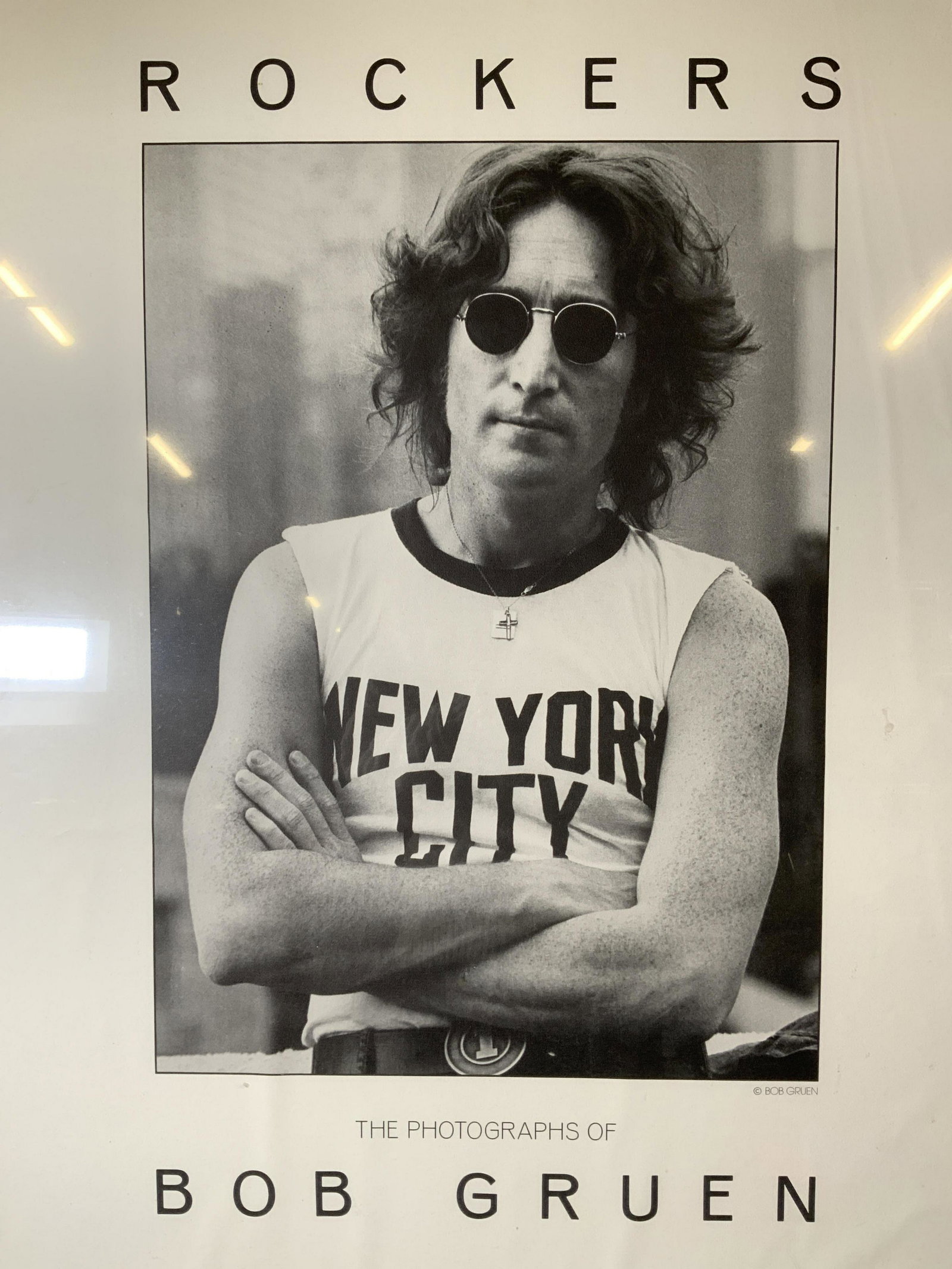 BOB GRUEN Rockers Gallery Poster: BOB GRUEN Rockers Gallery Poster, inscription reads ‘Rockers The Photographs of Bob GRUEN Radius Graphics’, subject a photo of John Lennon, measures 28 1/4 x 20 1/8 inches, black metal frame, surf