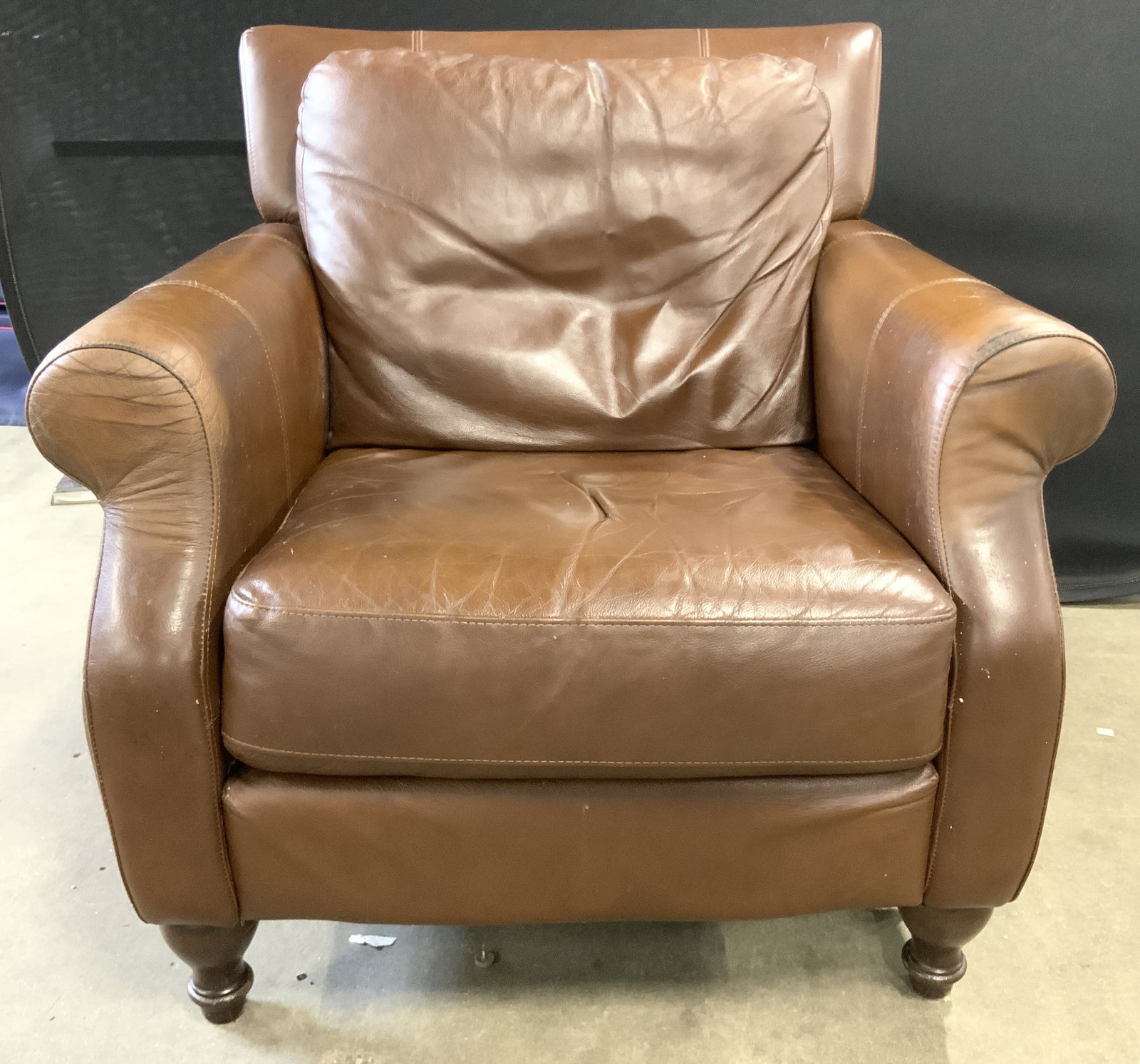 DIVANI CHATEAU D AX Leather Armchair: Underside of chair has tag which reads DIVANI CHATEAU D AX. Armchair is brown toned appears to be upholstered with genuine leather. Chair has brown toned carved wooden feet. Armchair, leather armchair