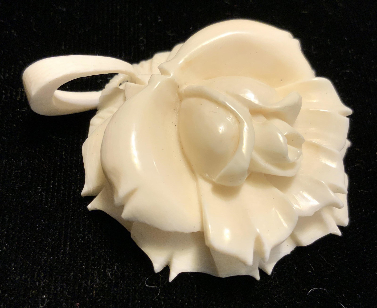 Carved White Bone Rosette Pendant Jewelry: Vintage hand carved rose, jewelry pendant, white bone, diameter app 2 inches, piece has depth with layered petals, has bone clip attachment, property of Trump Tower Manhattan Estate, and part of large