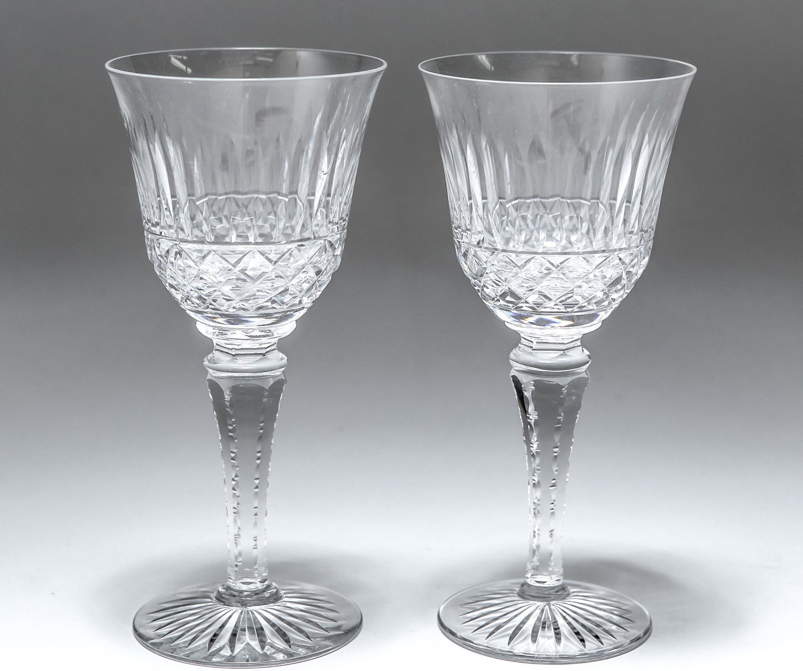 Cristallerie Lorraine Crystal Wine Goblets, Pair: Cristallerie Lorraine French crystal wine goblets / stemware, the pair cut with slash marks and crosshatch diamonds, on prism stems, the undersides with acid-etched stamp and the Cross of Lorraine. 7.