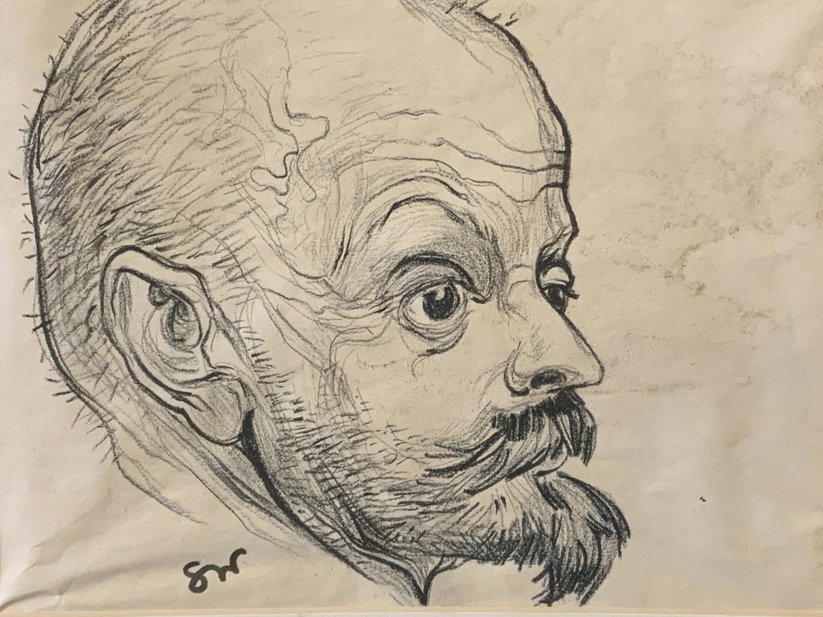 Initialed Lithograph Head of Man: Initialed lithograph head of man, initials to the lower center border read ‘SW’, subject the head of a man with a no hair other than a beard and mustache, white matting, not framed, measures 11 in