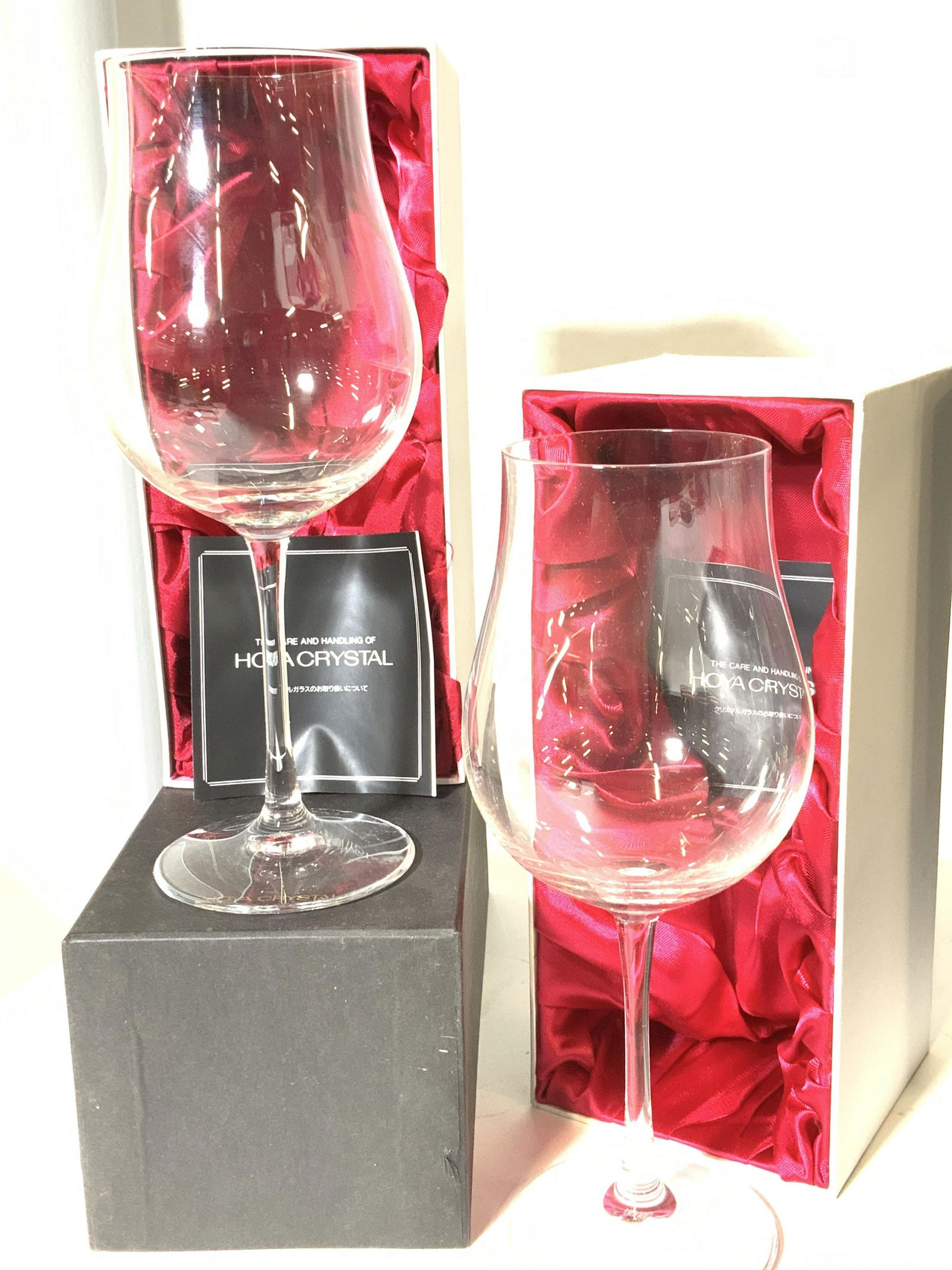 New In Box HOYA CRYSTAL WINE GLASSES, Tokyo: Crystal wine glasses with a lovely tulip shape , come in original Russia line fabric box with cushioning and pamphlet on how to care for your HOYA CRYSTAL 9.25 in ht, 3.75 widest width. Beautiful long