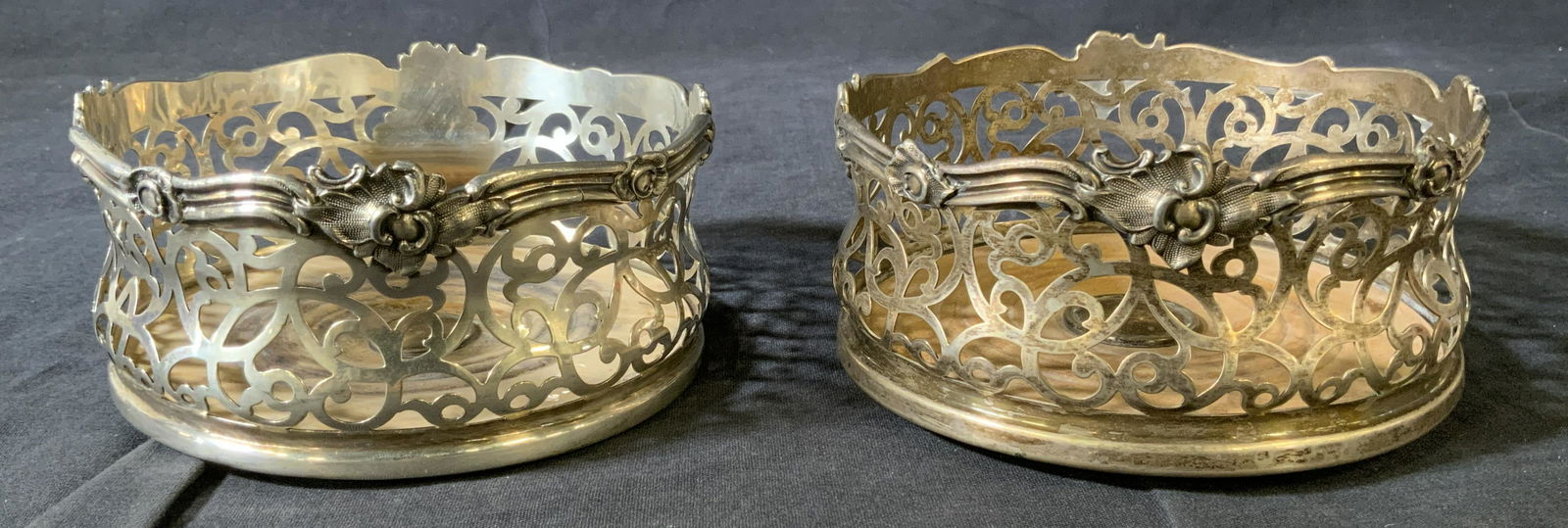 Pair Pierced Metal & Wood Wine Coasters: Pair Pierced Metal & Wood Wine Coasters, no apparent inscriptions or marks, both measure approximately 2 5/8 inches tall x 5 1/2 inches in diameter, denting and surface wear to pieces, Pair, pierced m