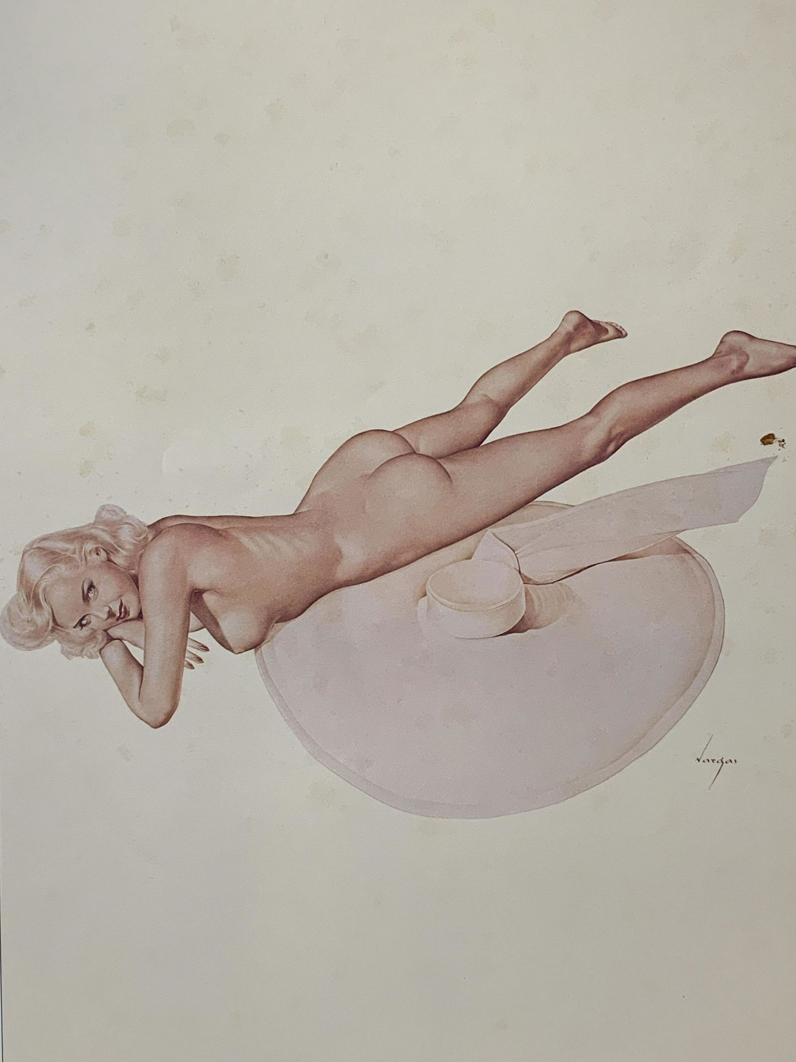 Vintage Alberto Vargas Pin-up Girl Litho & Matting: Vintage Alberto Vargas pin-up girl lithograph and matting, signature printed to the lower right corner reads ‘Vargas’, subject a nude woman lying down on her stomach with a large pink hat, comes w