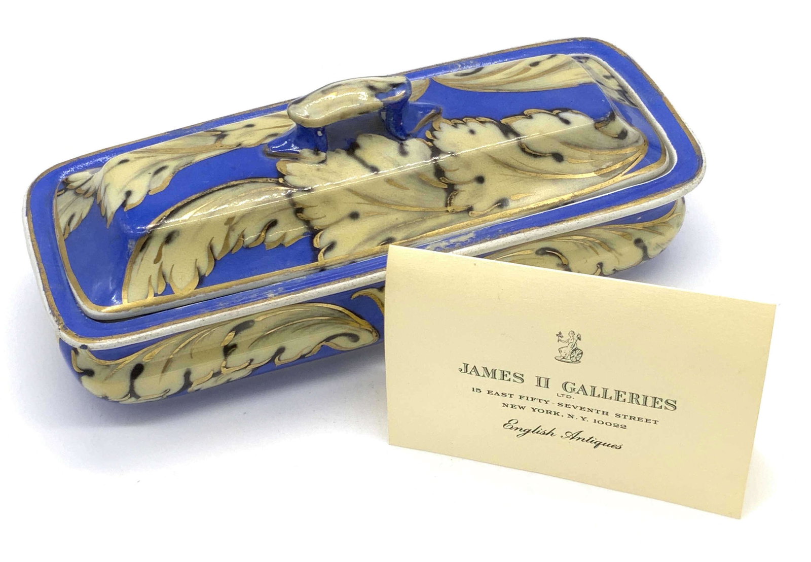 Antique 19th C Victorian English Tooth Brush Box: An antique ceramic tooth brush box with lid. The exterior of the piece is blue hued with cream hued Victorian scrollwork designs. The interior is white hued and features the same scrollwork. Interior 
