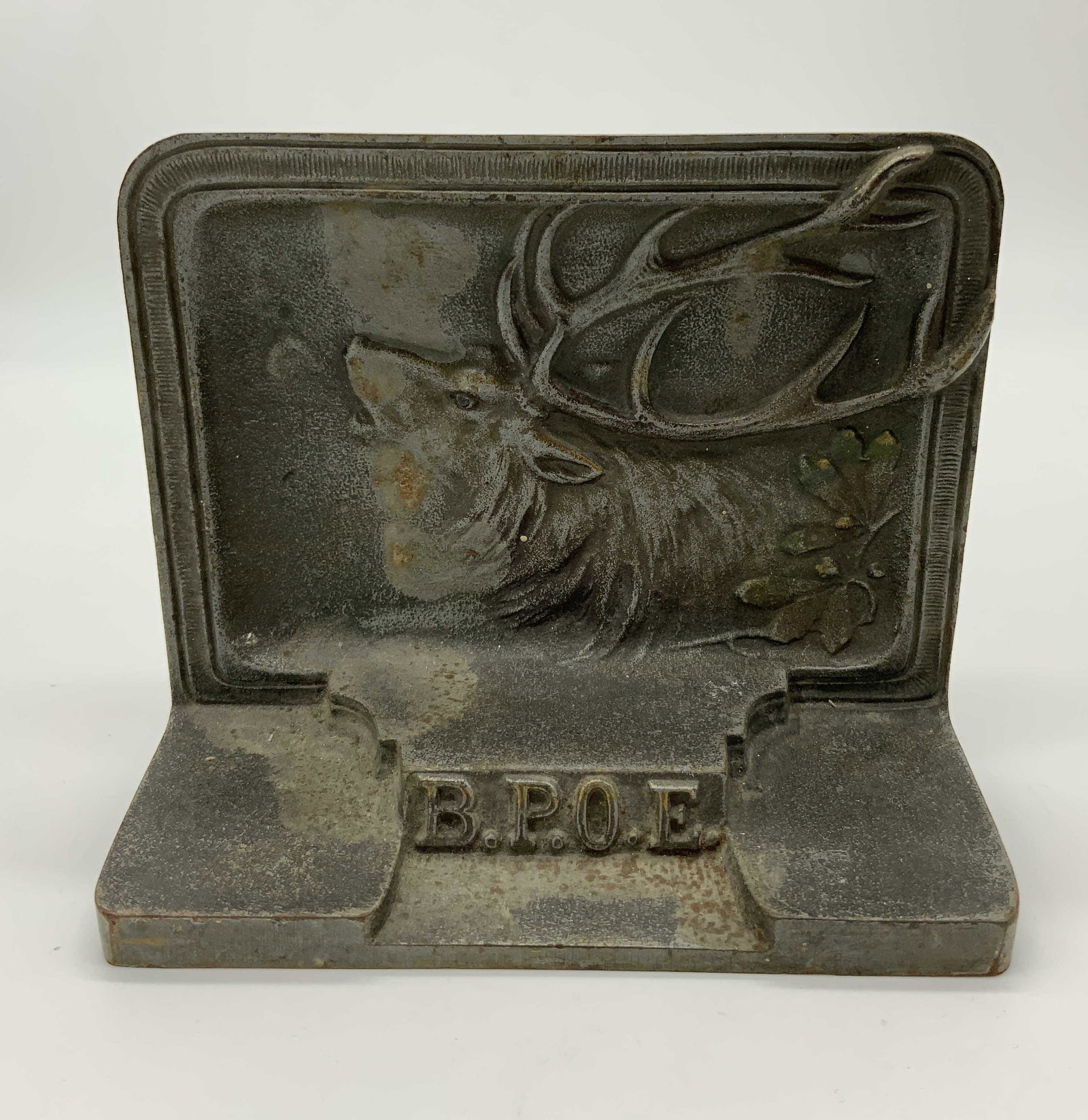 BRADLEY & HUBBARD Cast Iron Bookend: BRADLEY & HUBBARD Cast Iron Bookend, inscriptions read ‘B&H’ and ‘BPOE’, measures 4 1/2 inches tall x 5 1/2 inches at widest point, surface wear and rusting to piece, Bradley and Hubbard, cast