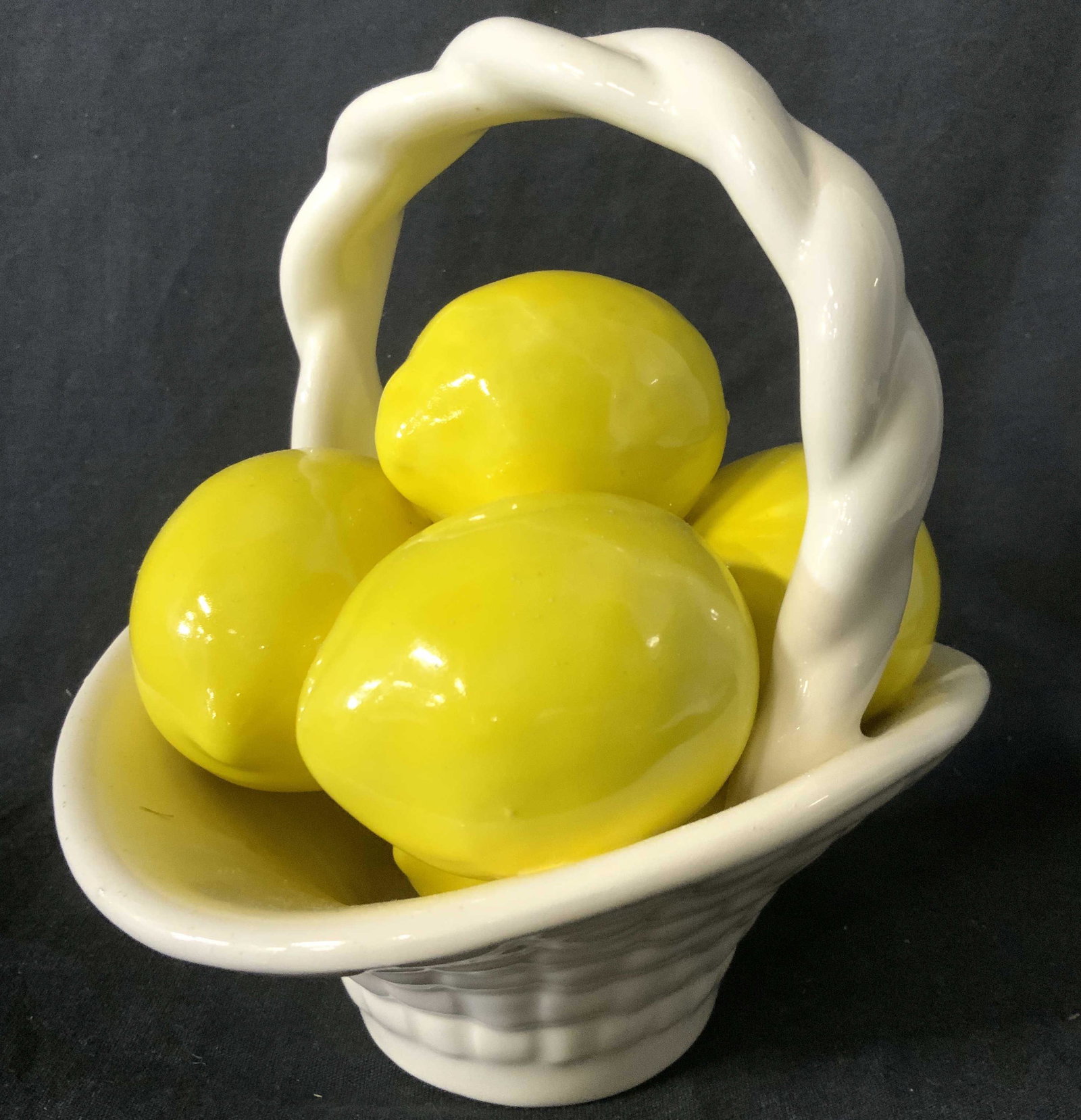 Porcelain Basket Of Lemons Decor: Piece is porcelain. Basket structure is cream while porcelain lemons are yellow toned. Piece measures approx 6.5 inches tall and wide 5.5 inches deep. Decor, tabletop decor, decorative arts, porcelain