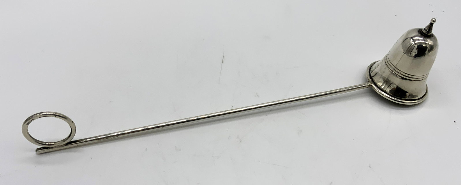 Sterling Silver Candle Snuffer: Sterling Silver Candle Snuffer, inscription reads ‘Sterling’, measures 9 inches long x 1 7/8 inches tall, weight: 1,11 ozt, surface wear and tarnishing to piece, Sterling silver, candle snuffer, d