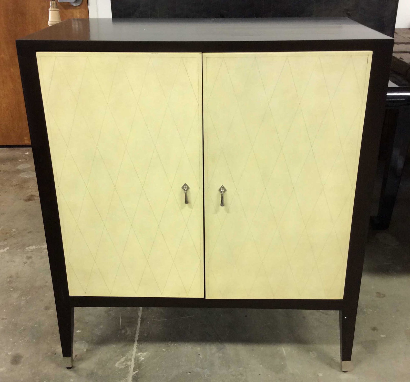 Etched Shagreen Leather Cabinet: Vintage Cabinet, two doores. Cream toned Shagreen Leather decorates the doors and sides of the Cabinet, one shelf can be found in its interior. The leather is detailed with and etched diamond pattern.