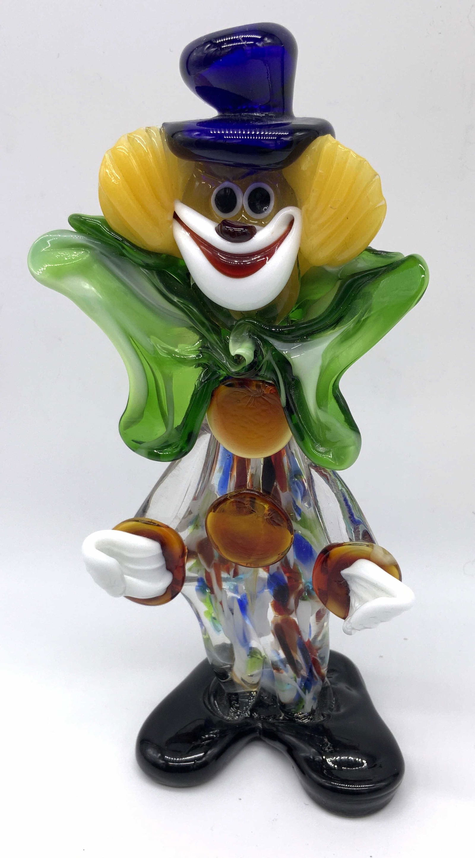 Murano Art Glass Clown Figurine: Murano Art glass clown figurine, done in the Murano style possibly genuine Murano glass but no apparent inscriptions or markings , subject an elongated clown figurine with an enlarged green bow tie an