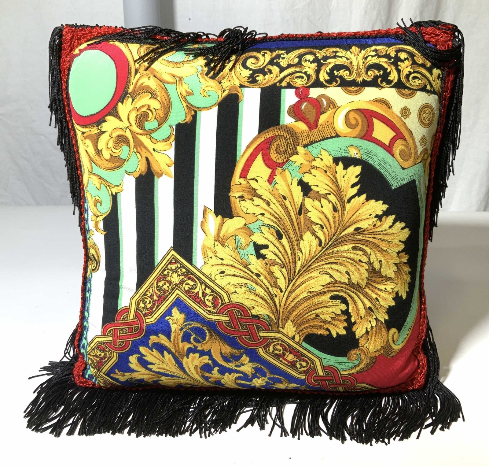 Delah McKay Luxury Toss Pillow: A luxury textile with grand Royal French patterns, 56% cotton, 25% polyester, other . Soft hand. Signature label sewn on to fabric over Velcro closure. All over thick black tassels which add to its de