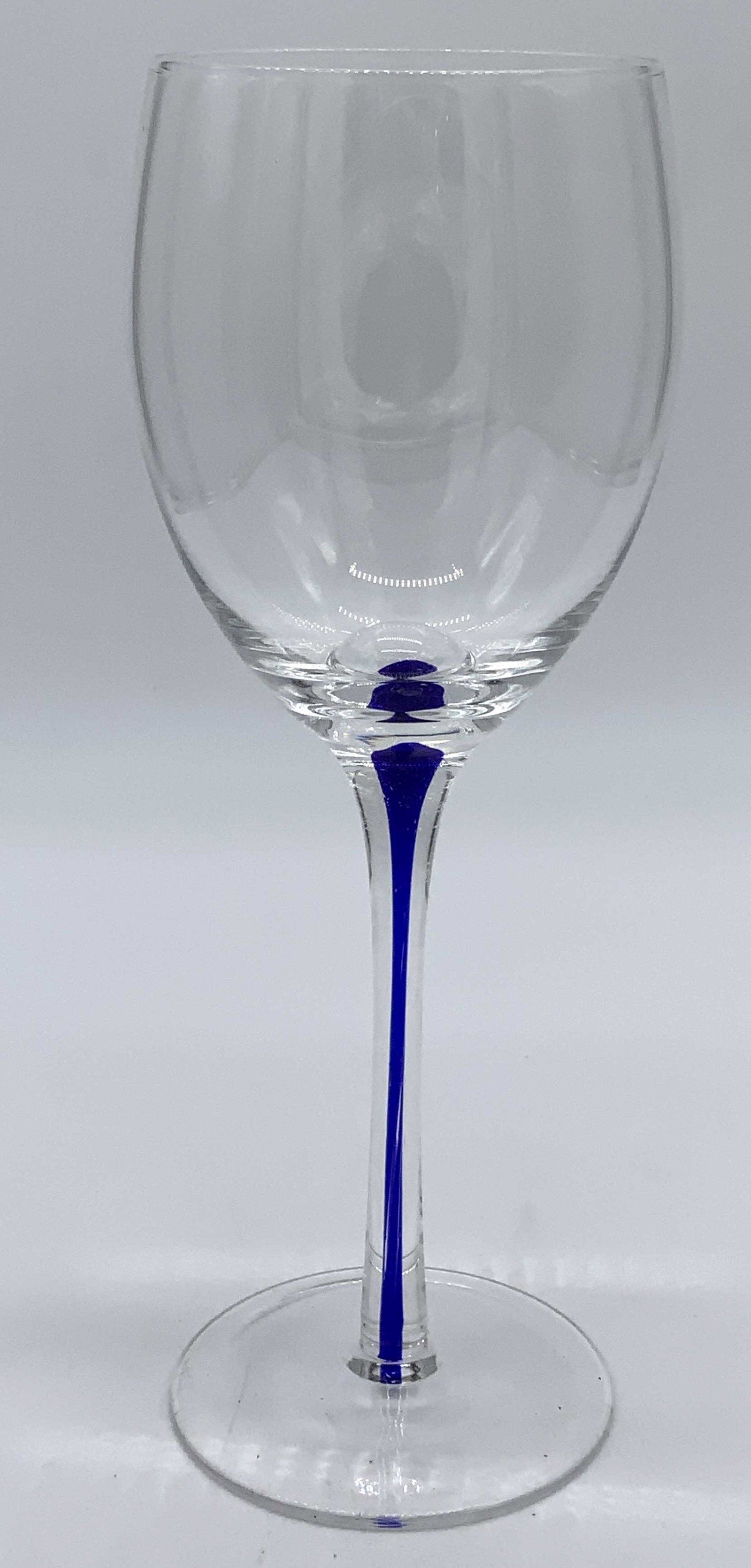 Set 8 Glass Stemware: Set of 8 wine glass. Stems are cobalt blue. Wear is consistent with age and use. Each measures approx 8.5 inches H, 3 inches in diameter. Stemware, wine glasses, Crystalware, drinking accessories, bar