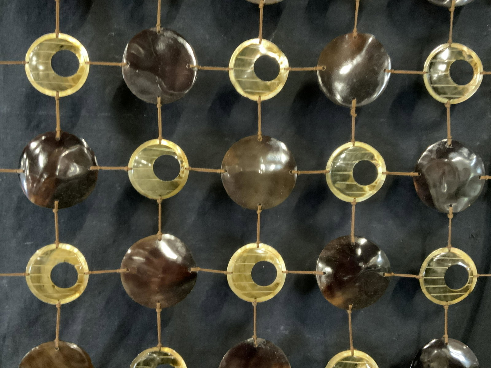 String and Resin MCM Minimalist Art work: String and resin minimalist art work, Crafts, no apparent inscriptions or markings, subject a rectangular frame with 50 resin circular pieces strung together with brown string, piece measures 36 inche
