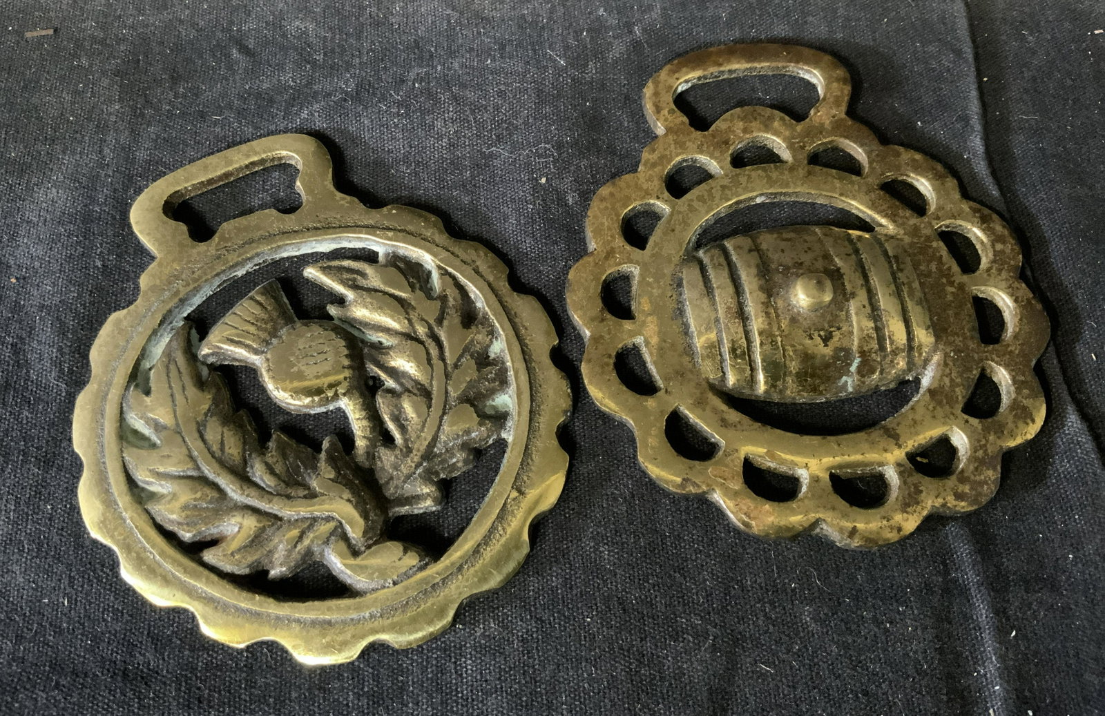 Pair Antique English Horse Brasses: Pair antique English Horse Brasses, no apparent inscriptions or markings to either, one brass displays a floral design while the other displays what appears to be a barrel design, both measures approx