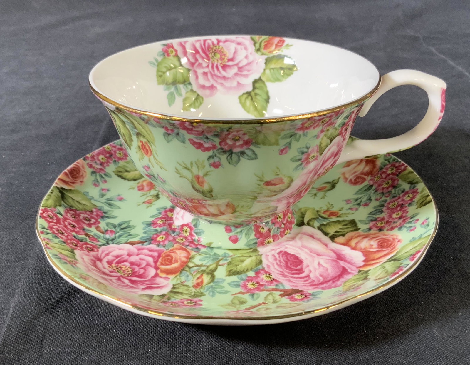 EDWARDIAN COLLECTION Bone China Teacup & Saucer: EDWARDIAN COLLECTION Bone China Teacup & Saucer, stamp reads ‘Edwardian Collection England’, teacup measures 2 3/8 inches tall x 5 inches at widest point, saucer measures 5 7/8 inches in diameter,