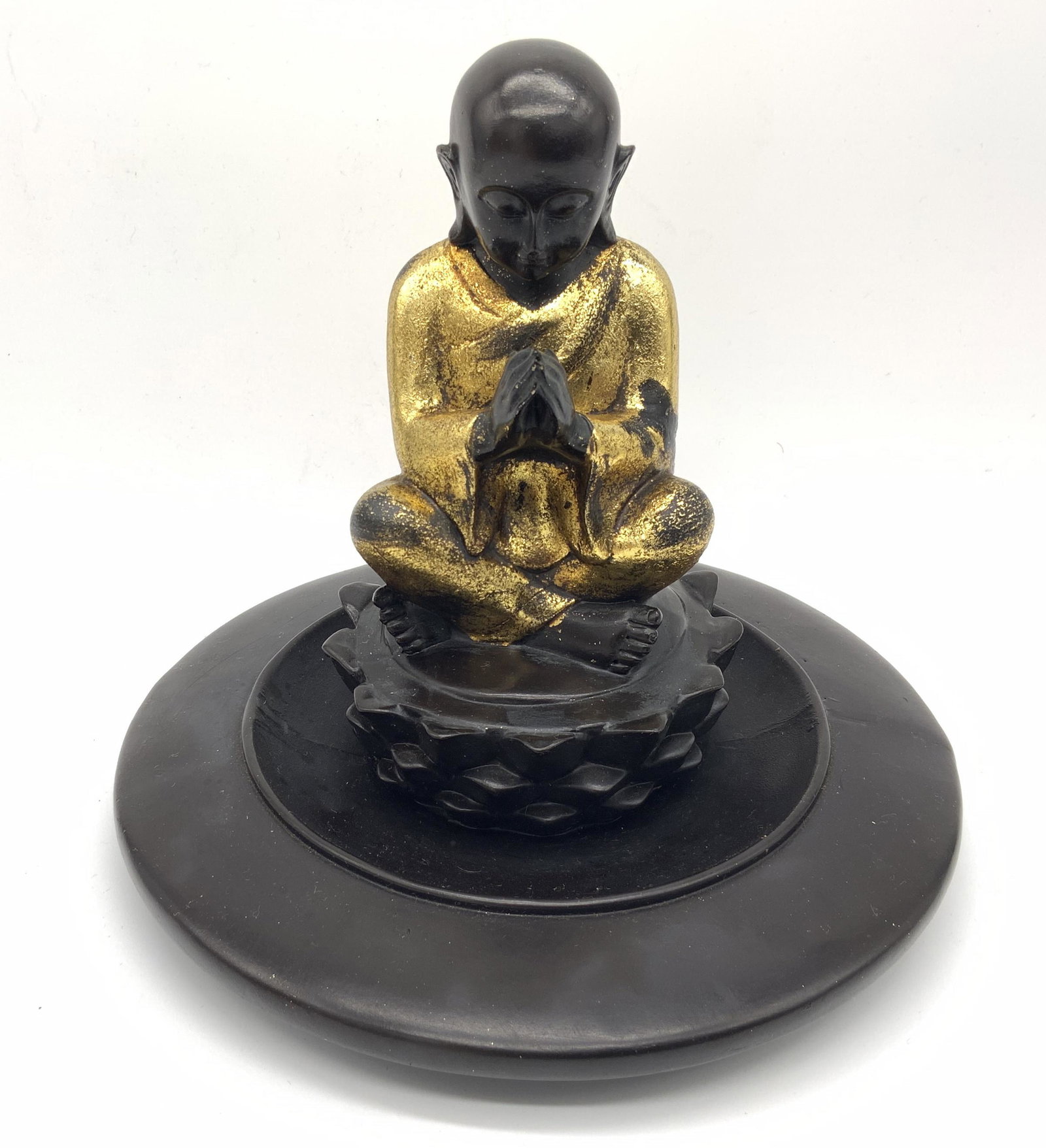 Wooden Buddhist Figural Trinket Dish: Wooden Buddhist figural trinket dish, no apparent inscriptions or markings, subject a wooden bowl with a figural sculpture to the center, figural depicts a man seated atop a lotus in prayer with legs 