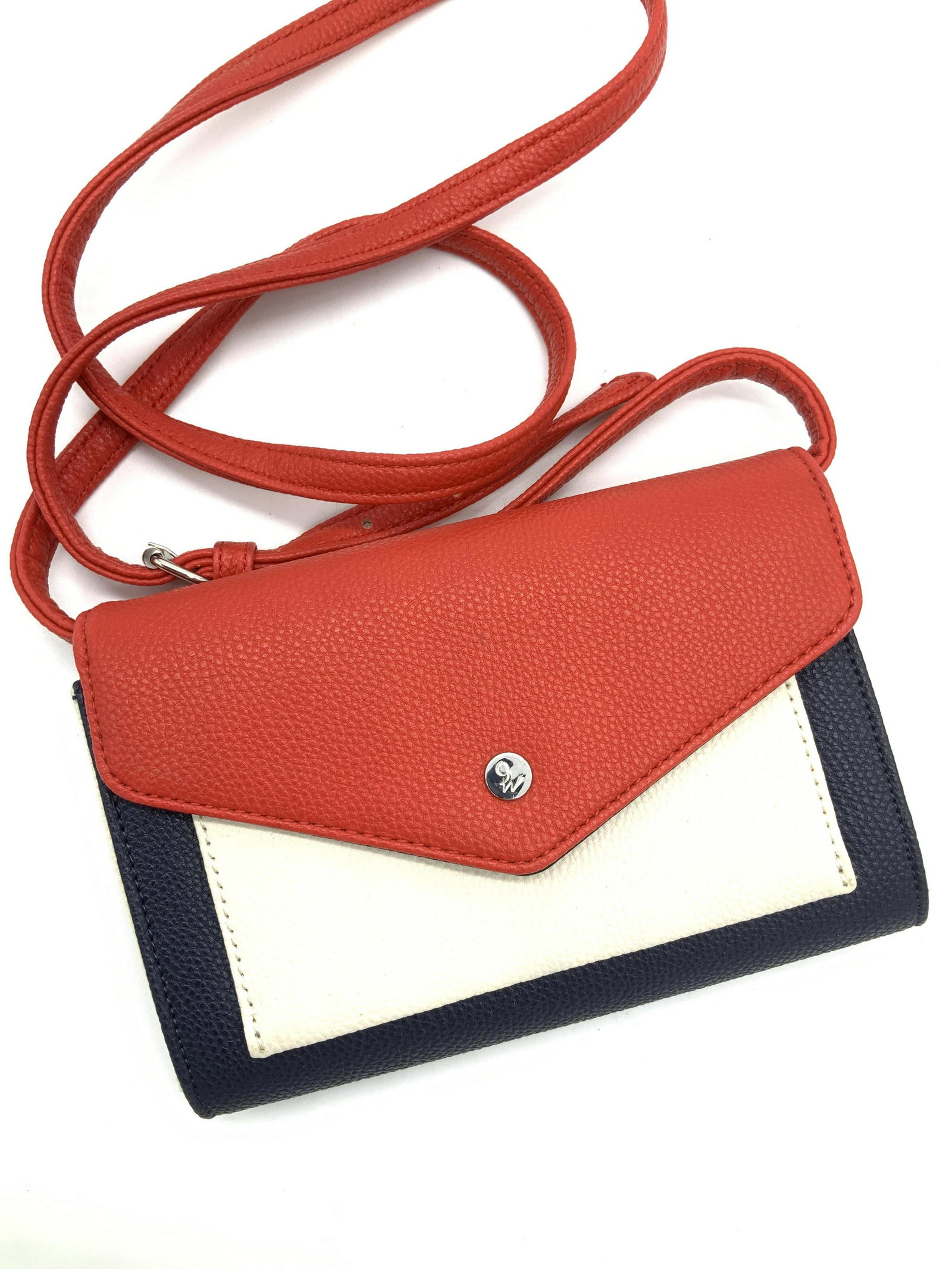 Nine West Red White & Blue Crossbody Bag: Faux Pebbled Leather in colors of red, white and blue, adjustable strap 22+ in. 3 divided inner sections with credit card slips. Bag measures 7.5 x 5 in. Nine West cross body bag, ladies Fashion Acces