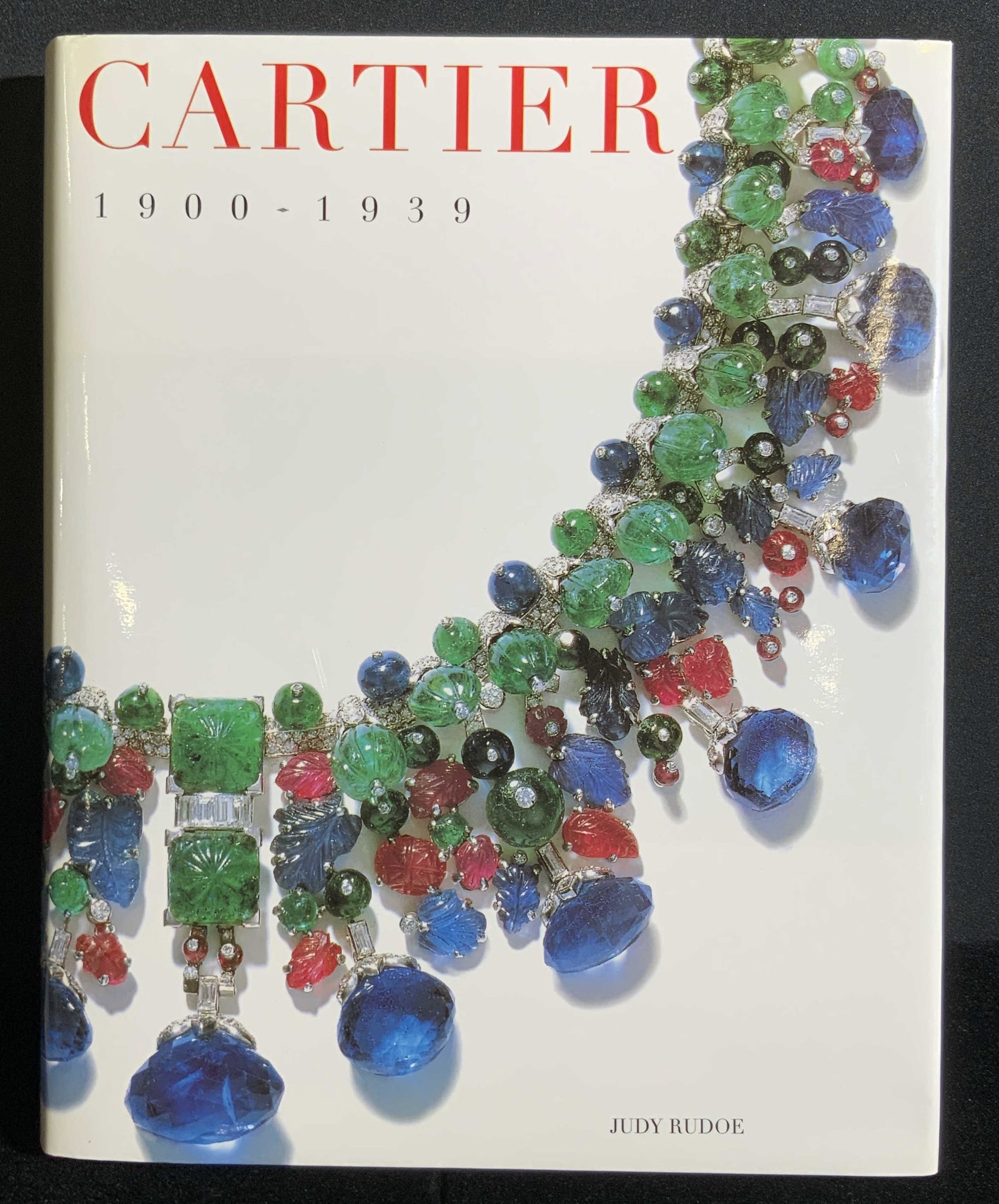 CARTIER 1900-1939 by Judy Rudoe, Coffee Table Book: Cartier 1900-1939 written by Judy Rudoe and published by Harry N. Abrams INC. Copyright 1997. The book features pictures and prose detailing Cartier during 1900-1939. Book has a hardcover and is weigh