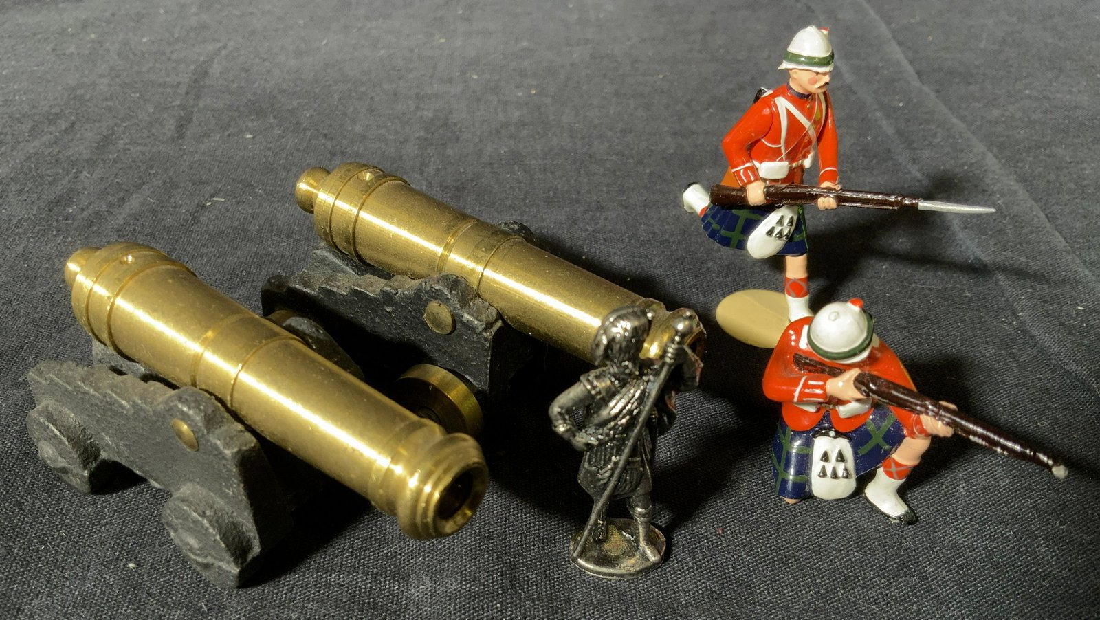 Group Lot 5 Soldier & Cannonball Figurines: Group 5 Soldier and cannonball figurines, no apparent inscriptions or markings to any, lot consists of two cannon ball figurines possibly made of brass and three Solider figurines two of which are par
