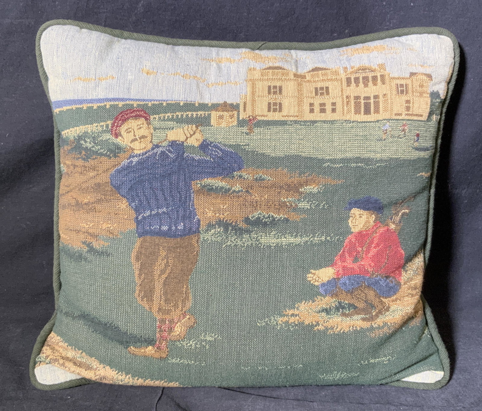 Golfing Tapestry Pillow: Golfing tapestry pillow, no apparent inscriptions or markings, pictorial to front depicts a man golfing with a caddie to his side and other golfers to the background, pillow measures 14 inches tall by