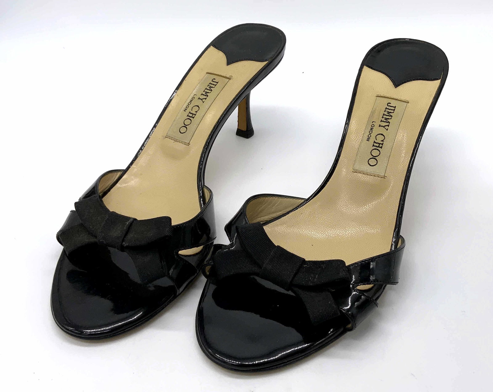 JIMMY CHOO Patent Leather Heels: JIMMY CHOO Patent Leather Heels, Inscriptions read ‘Jimmy CHOO London’ and ‘Vero Cuoio Made in Italy 39 1/2’, height of heel: 2 1/2 inches tall, surface wear to heels, Jimmy Choo, patent leath
