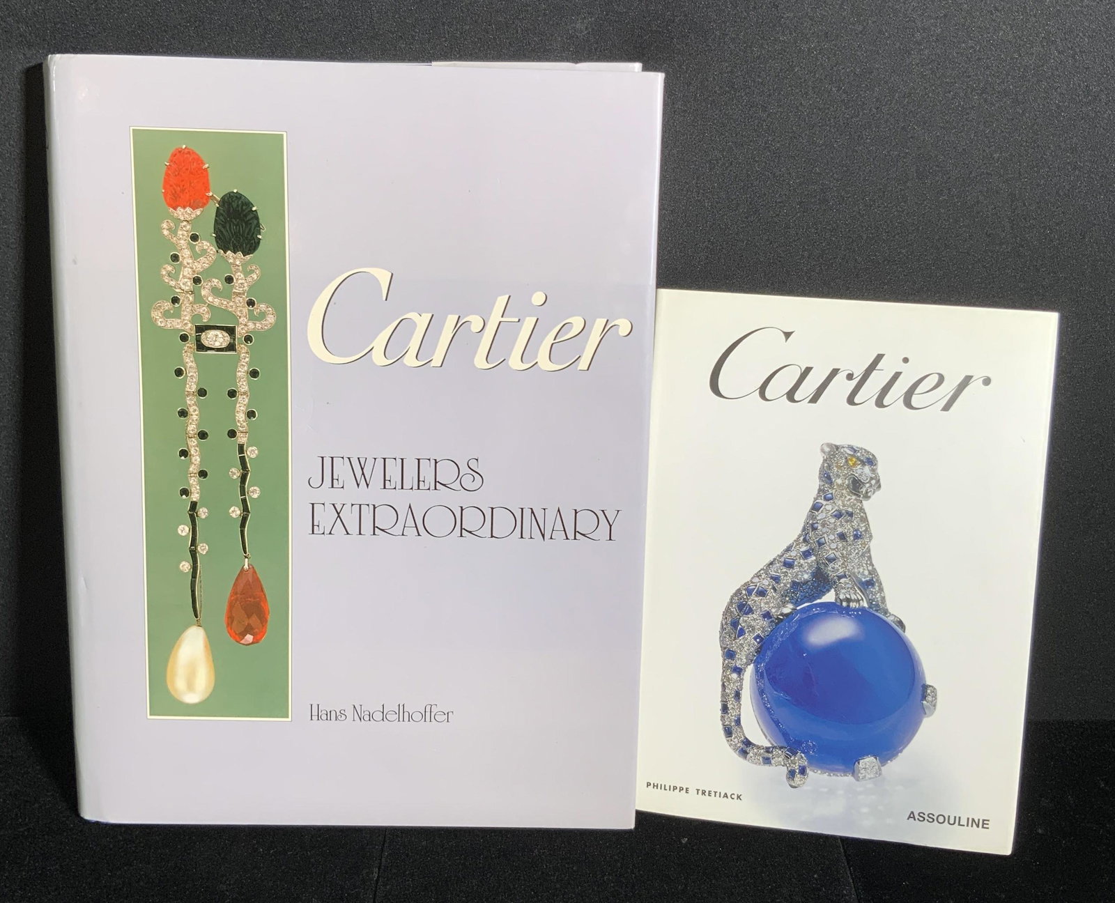 Lot 2 CARTIER Informational Jewelry Books: Two hardcover books titled Cartier (Philippe Tretiack, 2004, published by Assouline) & Cartier - Jewelers Extraordinary (Hans Nadelhoffer, 1984, published by Harry N. Abrams, vintage). One book is lar