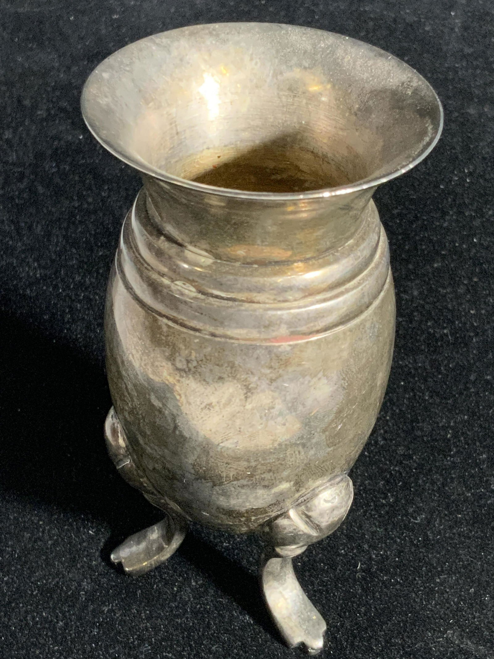 Vintage Silver Tone Metal Vessel: A polished silver tone metal vessel with etched and embossed accents. Underside has three feet. Approx. 4H x 2W in. Metal vase, Bud vase, metal vessel, metalware, metalwork, decorative arts, tabletop