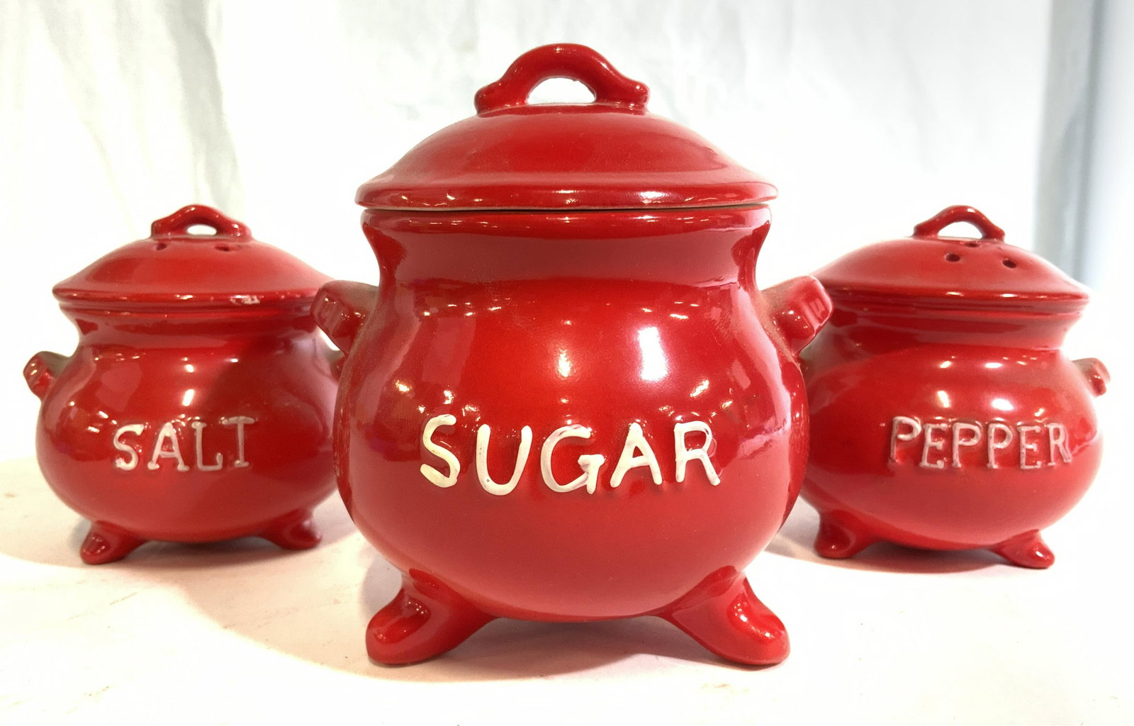 Set 3 LEGO Porcelain Sugar, Salt, & Pepper Shakers: Lot includes 1 sugar dish, 1 salt shaker & 1 pepper shaker. Each piece includes lid. Each dish has 3 feet. Sugar dish measures approx 4.25 inches tall 4 inches wide. LEGO Porcelain, tabletop accessori