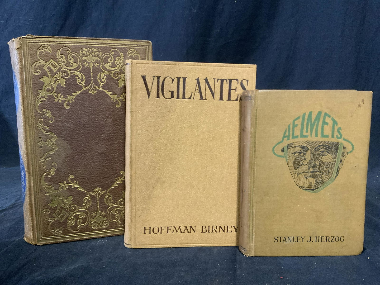 Lot 3 Vintage Hardcover Books: Lot 3 vintage hardcover books. ‘Helmets’ by Stanley Herzog, ‘Vigilantes’ by Hoffman Birney, ‘Burns’ Poetical Works’ by A Cunningham Esq. Bindings have degraded to a degree. One cover emb