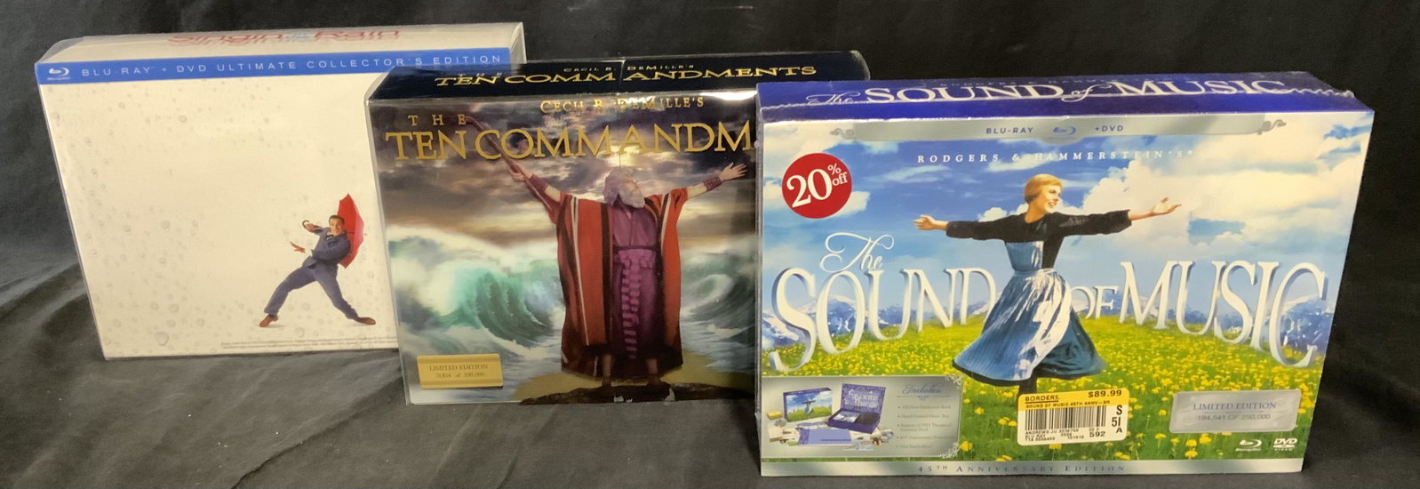 Lot 3 Collectors Edition BluRay Movies: Lot of 3 collectors edition blu ray movies. Includes Ten Commandments, Singing in the Rain, and The Sound of Music. Measures approx 8 inches long, 11.5 inches w. Wear is consistent with age and use. M