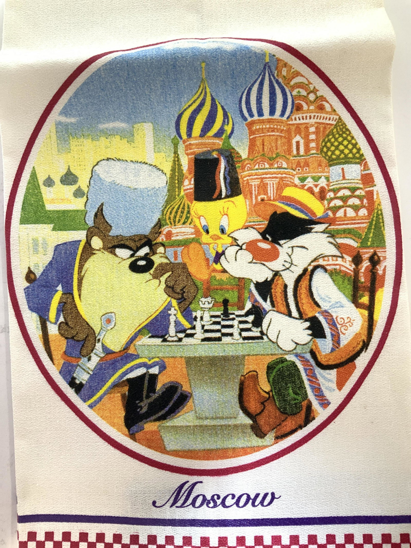 Collectible LOONEY TUNES Tea Towels, 4: NEVER USED Tea towels featuring Bugs Bunny In Venice, Tweety Bird, Sylvester and Tasmanian Devil Playing Chess in Moscow, Bugs Bunny in London, Pepe Le Pew, Penelope and Bugs in Paris. C. 1993 labeled