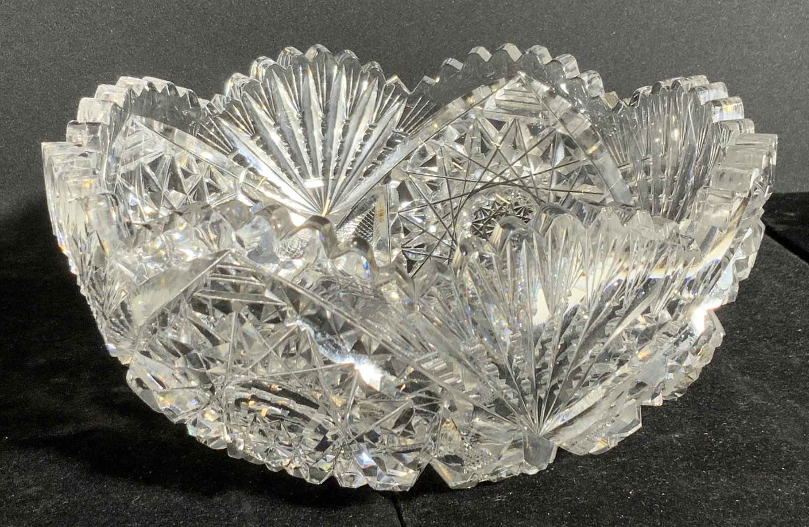 Hand Cut Crystal Sawtooth Bowl: A colorless crystal bowl with hand cut designs and a sawtooth rim. Piece is weighty. Approx. 4H x 8W in. Art glass crystal, hand cut crystal, crystal bowl, sawtooth crystal, tableware, crystalware, ta