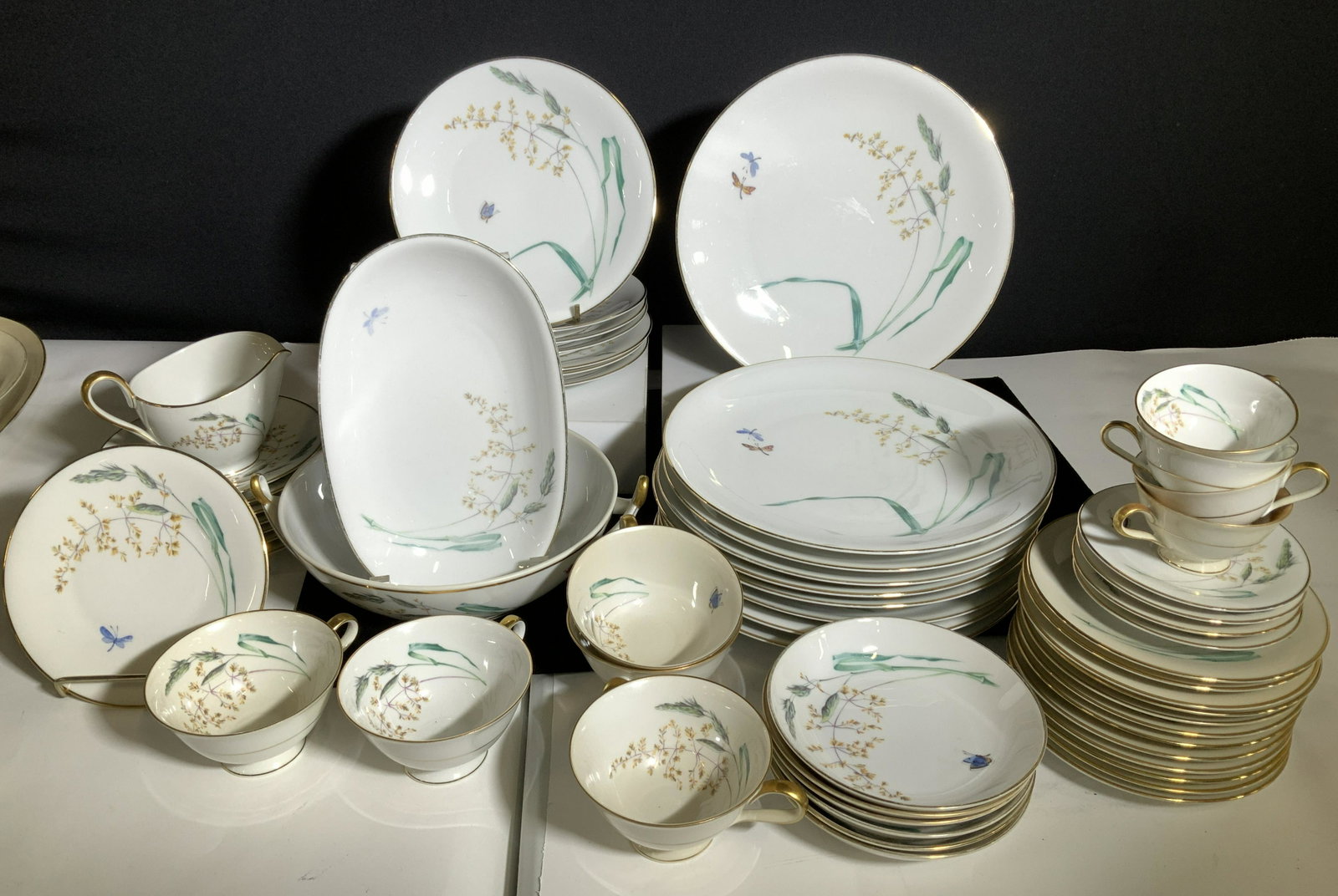 HEINRICH H&C Sommer Vntg Chinaware Set: Porcelain Bavarian Chinaware Set, signed Heinrich H&C Selb, Sommer Pattern w/ Multimotif Wildgrass & Butterflies Coupe scoop Smooth & Gold Trim, Discontinued. Set includes some pieces that are yellowe