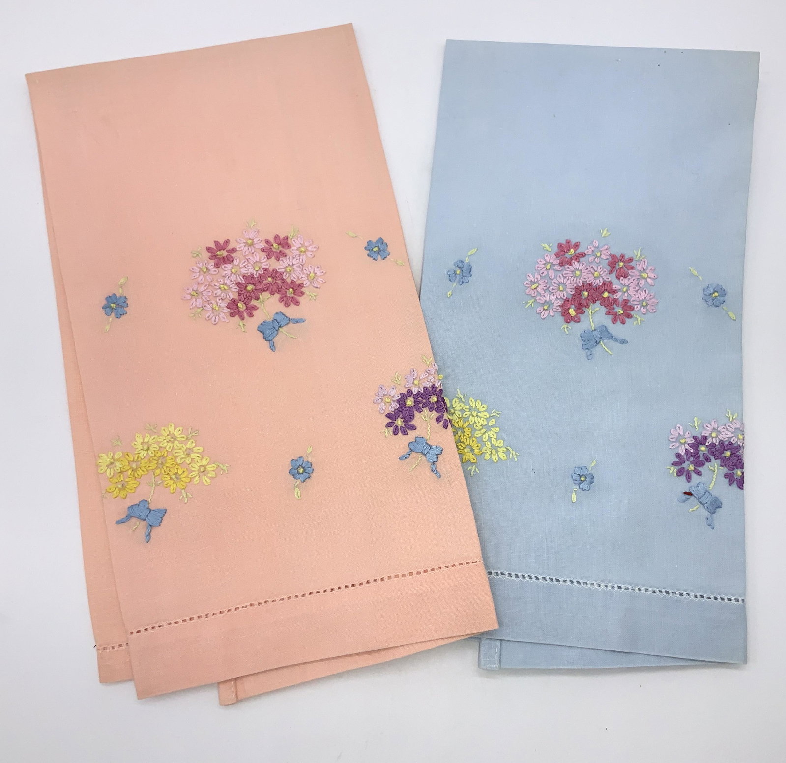 Collectible Pair Embroidered Cotton Hand Towels: Peach and baby blue towels with posies of hand embroidered wildflowers. Smooth cotton, not previously used. 19.25 x 12.75 in. Hand napery, tea towels, hand towels, bathroom accessory, hand embroidery,