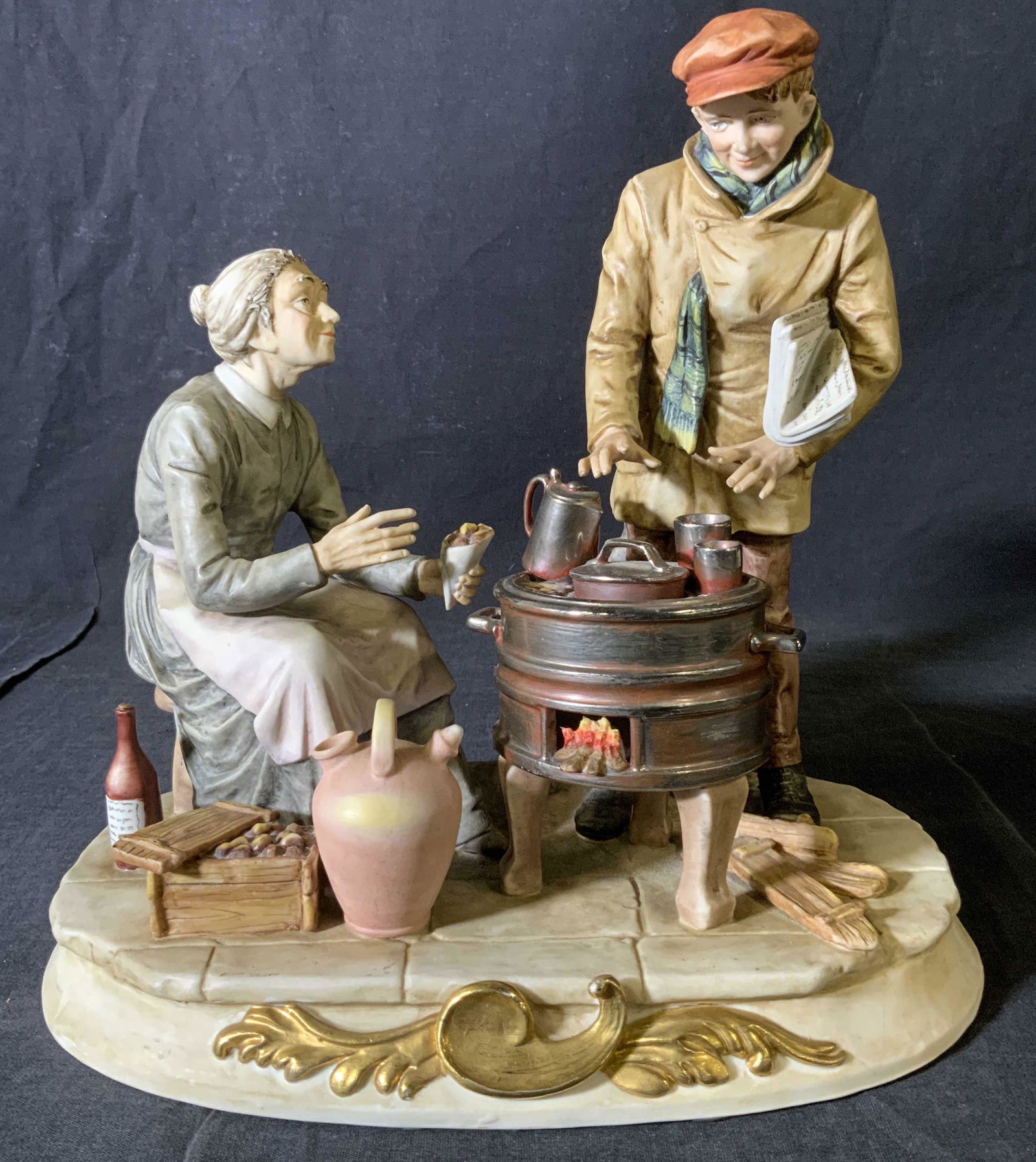 Vintage ARNART Porcelain Group Figurine: Vintage ARNART Porcelain Group Figurine with metal stove, label to base illegible, inscription below crossed arrow mark reads ‘S8508’, subject two figures in front of a stove, measures 10 7/8 inch