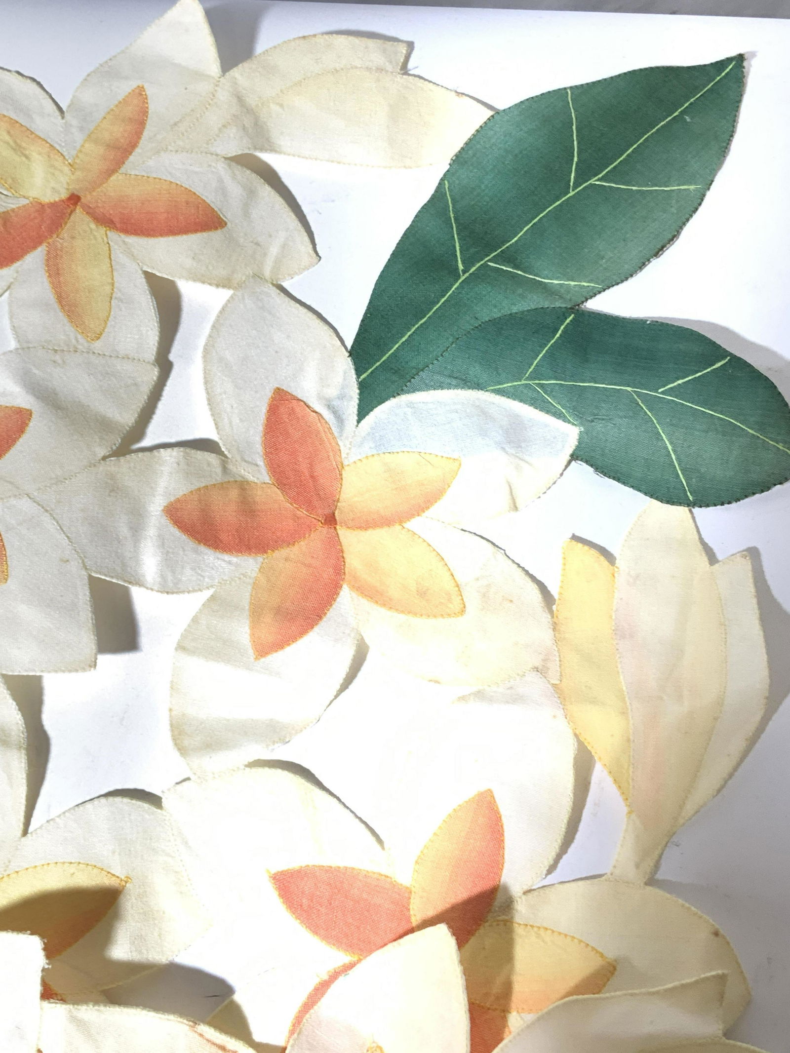 Pair Tropical Flower Linen Table Runners: Bright yellow and Orange flowers with deep green leaves, pierced openwork furniture or table decor, can be used as runners or coffee table centerpiece. Measure 35 x 15.5 in. Blemishing in spots consis
