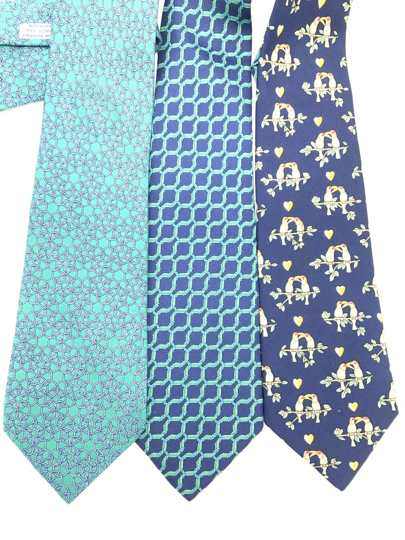 3 Silk HERMÈS PARIS SILK Shirt Ties: All Ties Hermes, signed with label, all silk, all Made in France. Teal color with maritime rope pattern. No. 7822UA, 57 in. Navy blue color with Teal Green interlocking box pattern , no. 7124 FA, 58.5