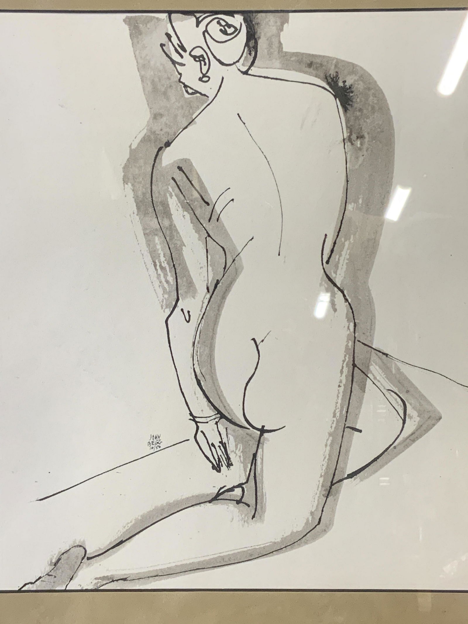 JOHN BEGG Signed Minimalist Lithograph: John Begg Signed Minimalist lithograph, signature and date to left center section reads ‘John Begg 10/50’, subject a nude figure with back facing toward the viewer, tan matting, silver toned metal